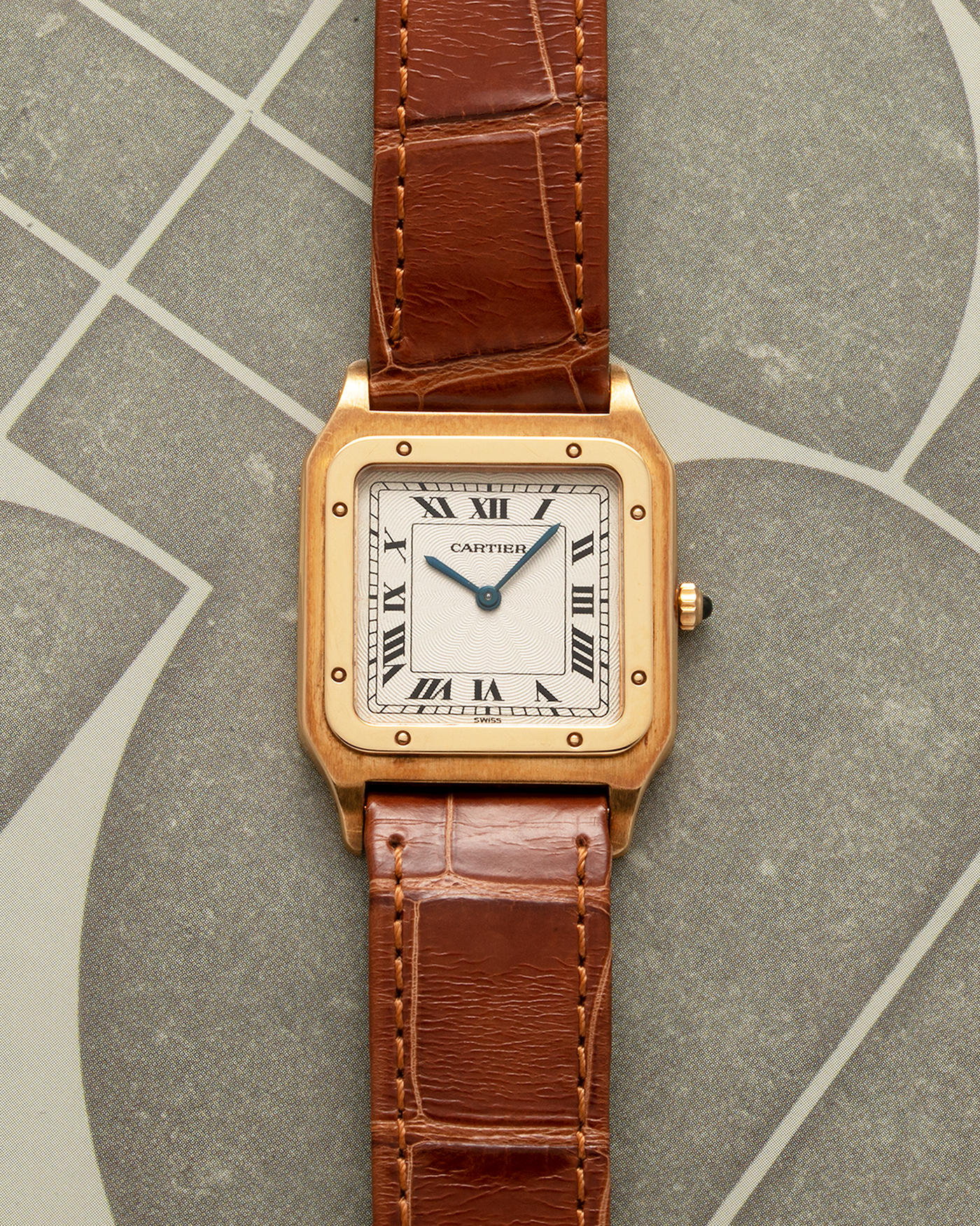 Brand: Cartier Year: 1990s Model: Santos-Dumont Reference: 1576 Material: 18-carat Yellow Gold Movement: Cartier Cal. 021 MC (Frédéric Piguet Cal. 21 based), Manual-Winding Case Diameter: 27mm Lug Width: 18mm Strap: Cartier Light Brown Alligator Leather Strap with Signed 18-carat Yellow Gold Tang Buckle