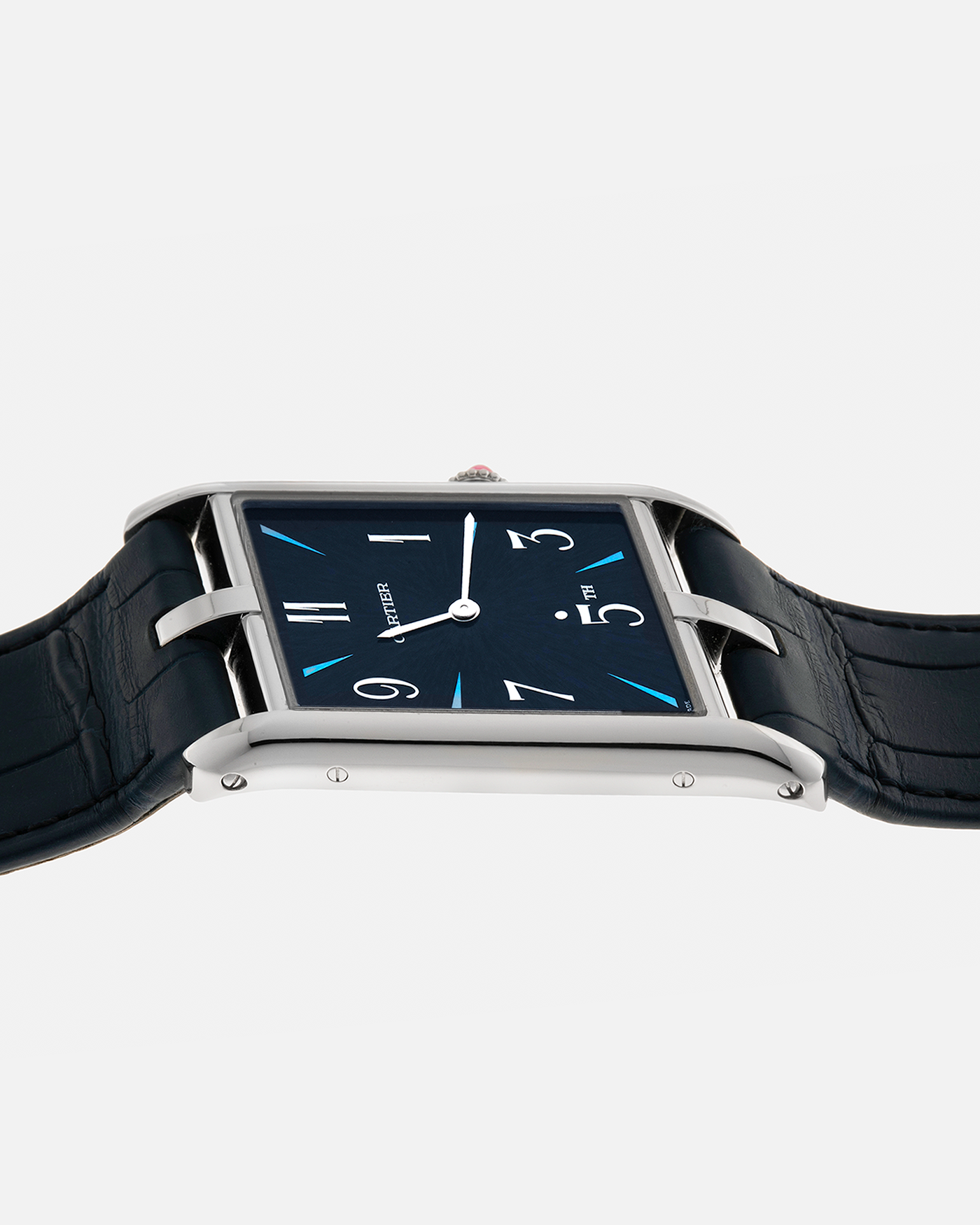 Brand: Cartier
Year: 2023
Model: Tank Asymétrique 5th Ave New York Edition
Reference: WGTA0120
Material: Platinum 950
Movement: Cartier Cal. 1917MC, Manual-Winding
Case Dimensions: 47mm x 26mm x 6.4mm (44.5mm Lug-to-Lug)
Strap: Cartier Blue Alligator Leather Strap with Signed Platinum 950 Tang Buckle