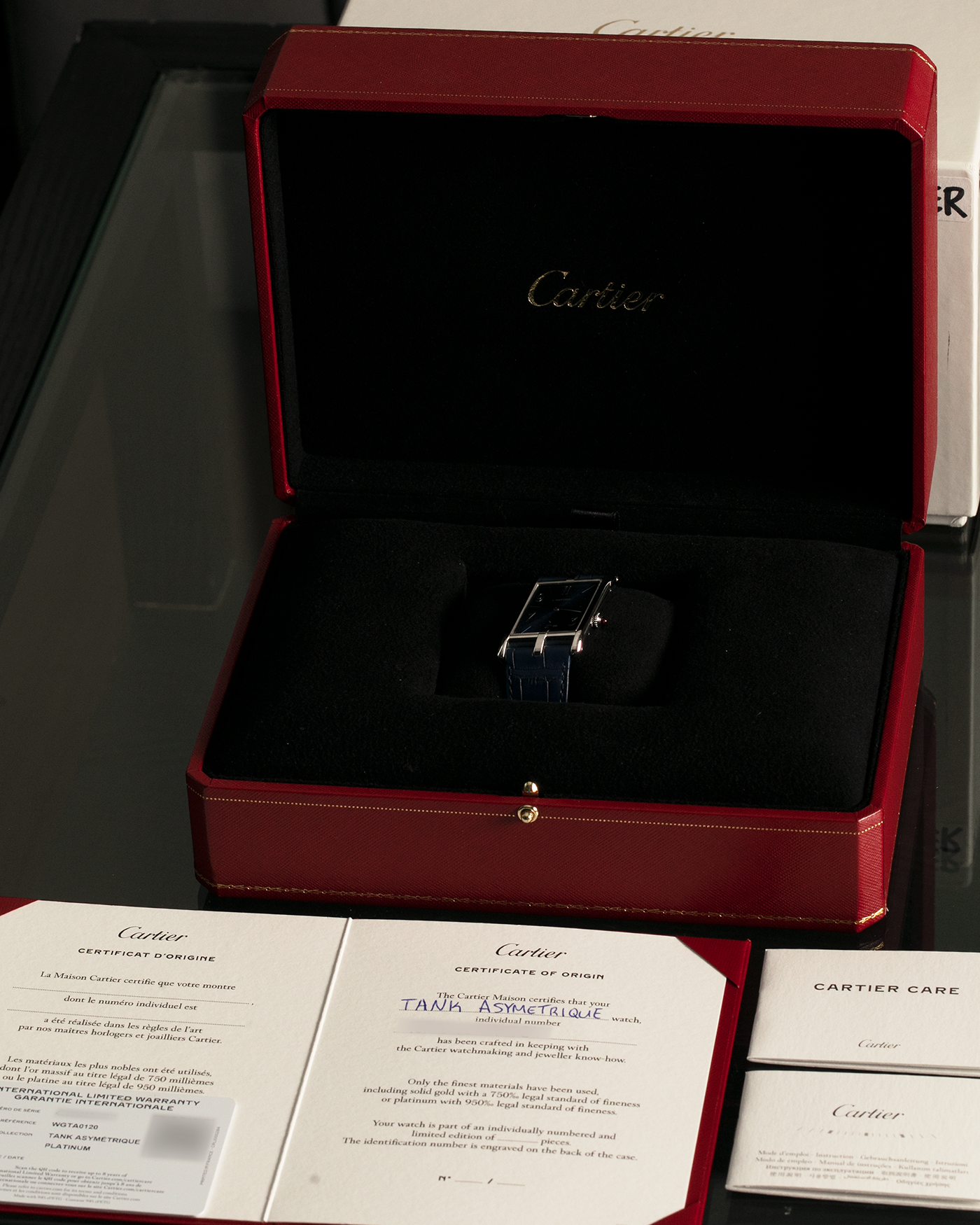 Brand: Cartier
Year: 2023
Model: Tank Asymétrique 5th Ave New York Edition
Reference: WGTA0120
Material: Platinum 950
Movement: Cartier Cal. 1917MC, Manual-Winding
Case Dimensions: 47mm x 26mm x 6.4mm (44.5mm Lug-to-Lug)
Strap: Cartier Blue Alligator Leather Strap with Signed Platinum 950 Tang Buckle