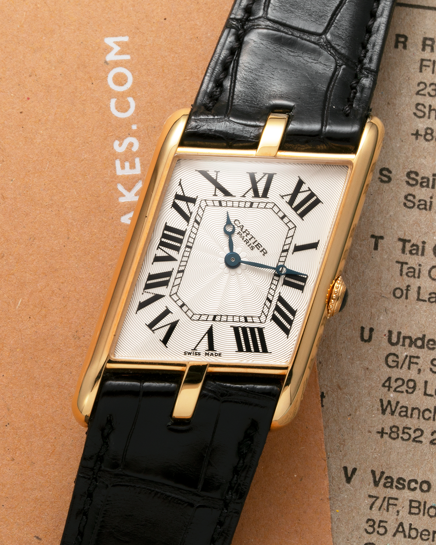 Brand: Cartier Year: 2006 Model: Tank Asymétrique CPCP, Limited Edition of 150 pieces Reference Number: 2842 Material: 18-carat Yellow Gold Movement: Cartier Cal. 9770 MC, Manual-Winding Case Diameter: 26.5mm x 41mm x 7.5mm Strap: Cartier Black Alligator Leather with Signed 18-carat Yellow Gold Deployant Clasp