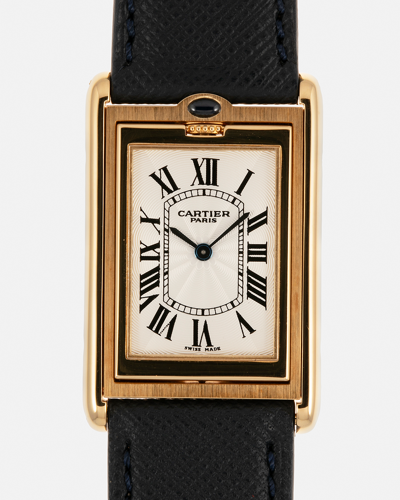 Brand: Cartier Year: 2000s Model: Collection Privée Cartier Paris Tank Basculante Material: 18-carat Yellow Gold Movement: Cartier Cal. 060MC (F. Piguet Cal. 610), Manual-Winding Case Diameter: 25mm x 39mm Lug Width: 20mm Strap: Nostime Navy Textured Calf Leather Strap with Signed 18-carat Yellow Gold Deployant Clasp, additional Cartier Brown Textured Calf Leather Strap (Used)