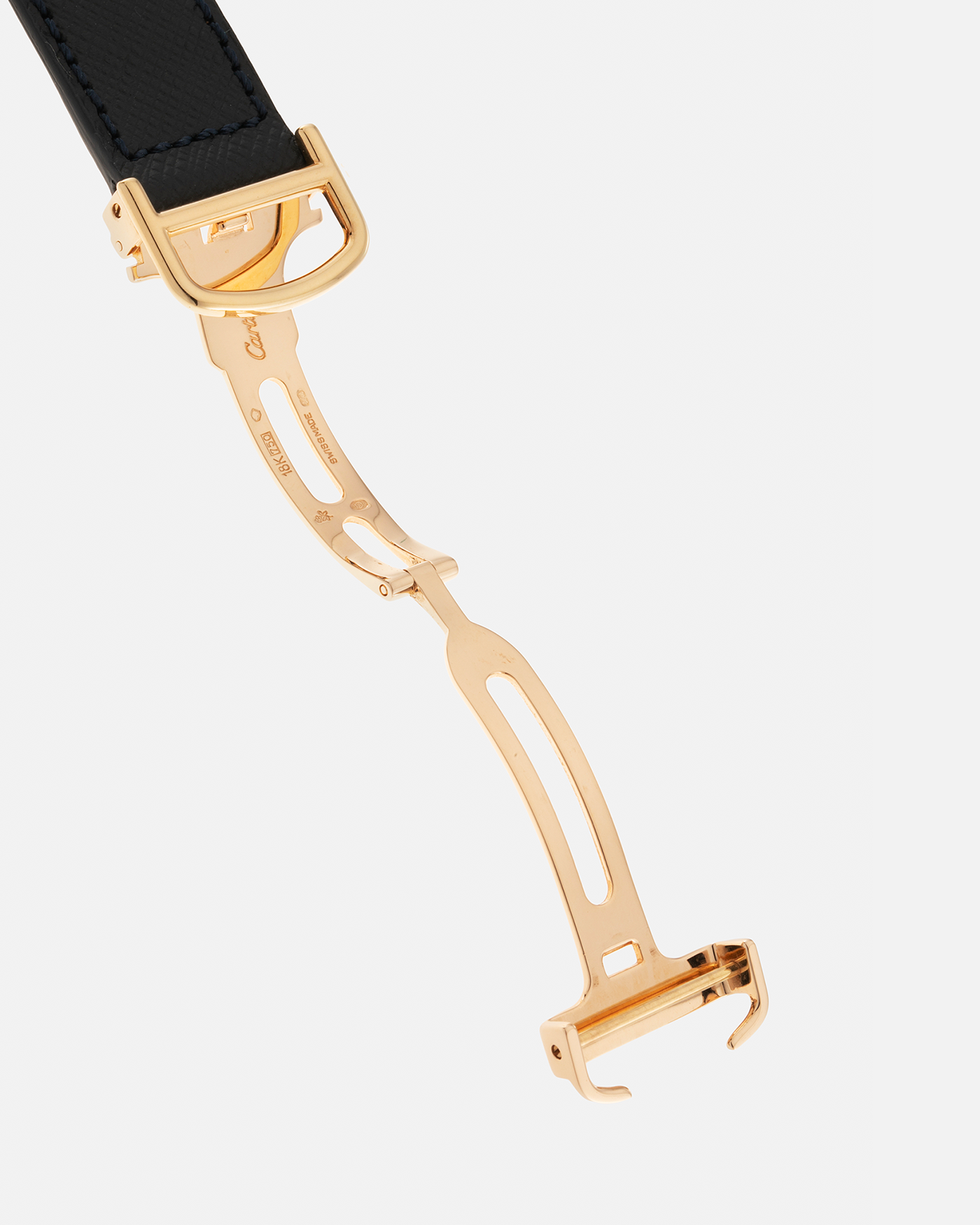 Brand: Cartier Year: 2000s Model: Collection Privée Cartier Paris Tank Basculante Material: 18-carat Yellow Gold Movement: Cartier Cal. 060MC (F. Piguet Cal. 610), Manual-Winding Case Diameter: 25mm x 39mm Lug Width: 20mm Strap: Nostime Navy Textured Calf Leather Strap with Signed 18-carat Yellow Gold Deployant Clasp, additional Cartier Brown Textured Calf Leather Strap (Used)