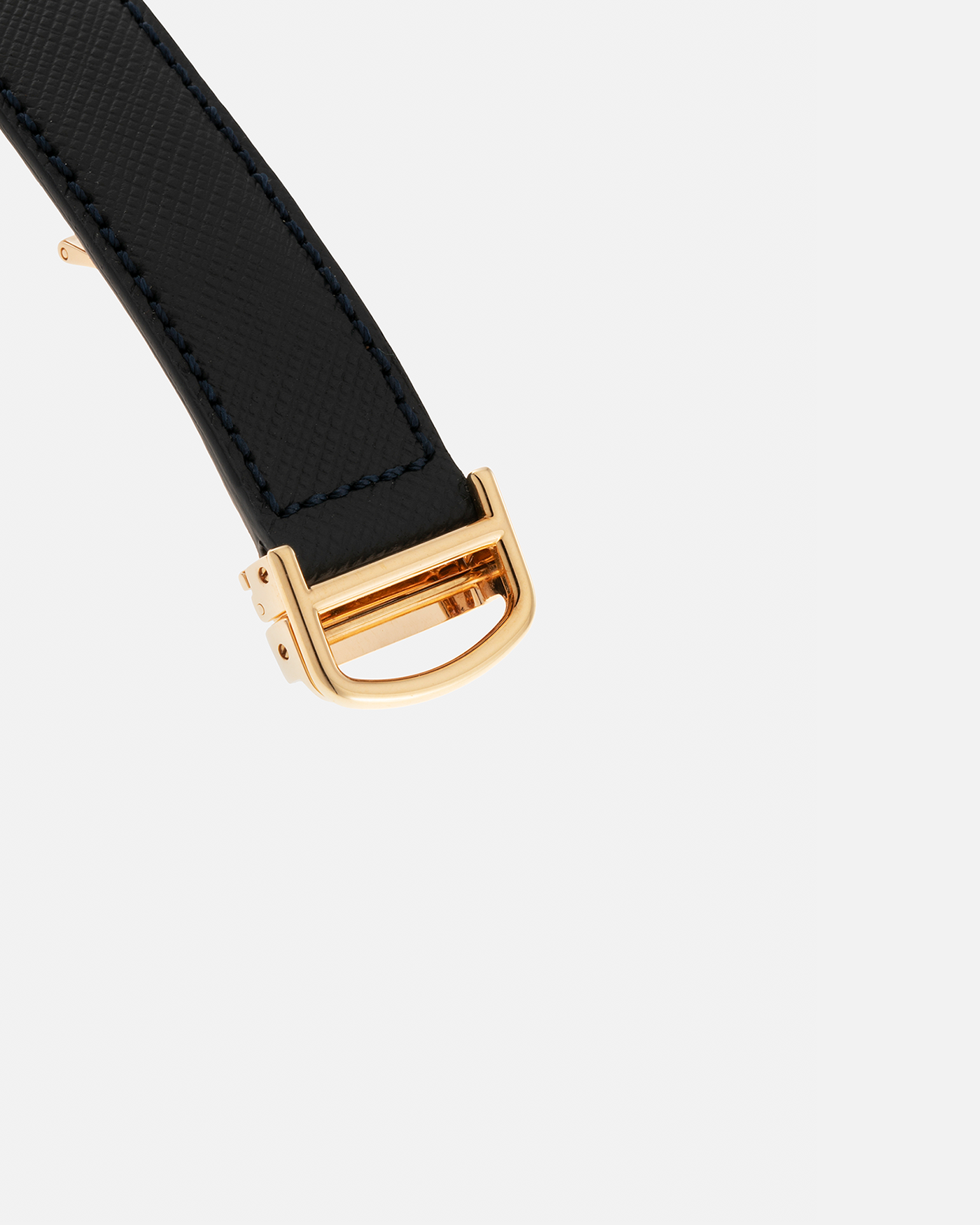 Brand: Cartier Year: 2000s Model: Collection Privée Cartier Paris Tank Basculante Material: 18-carat Yellow Gold Movement: Cartier Cal. 060MC (F. Piguet Cal. 610), Manual-Winding Case Diameter: 25mm x 39mm Lug Width: 20mm Strap: Nostime Navy Textured Calf Leather Strap with Signed 18-carat Yellow Gold Deployant Clasp, additional Cartier Brown Textured Calf Leather Strap (Used)