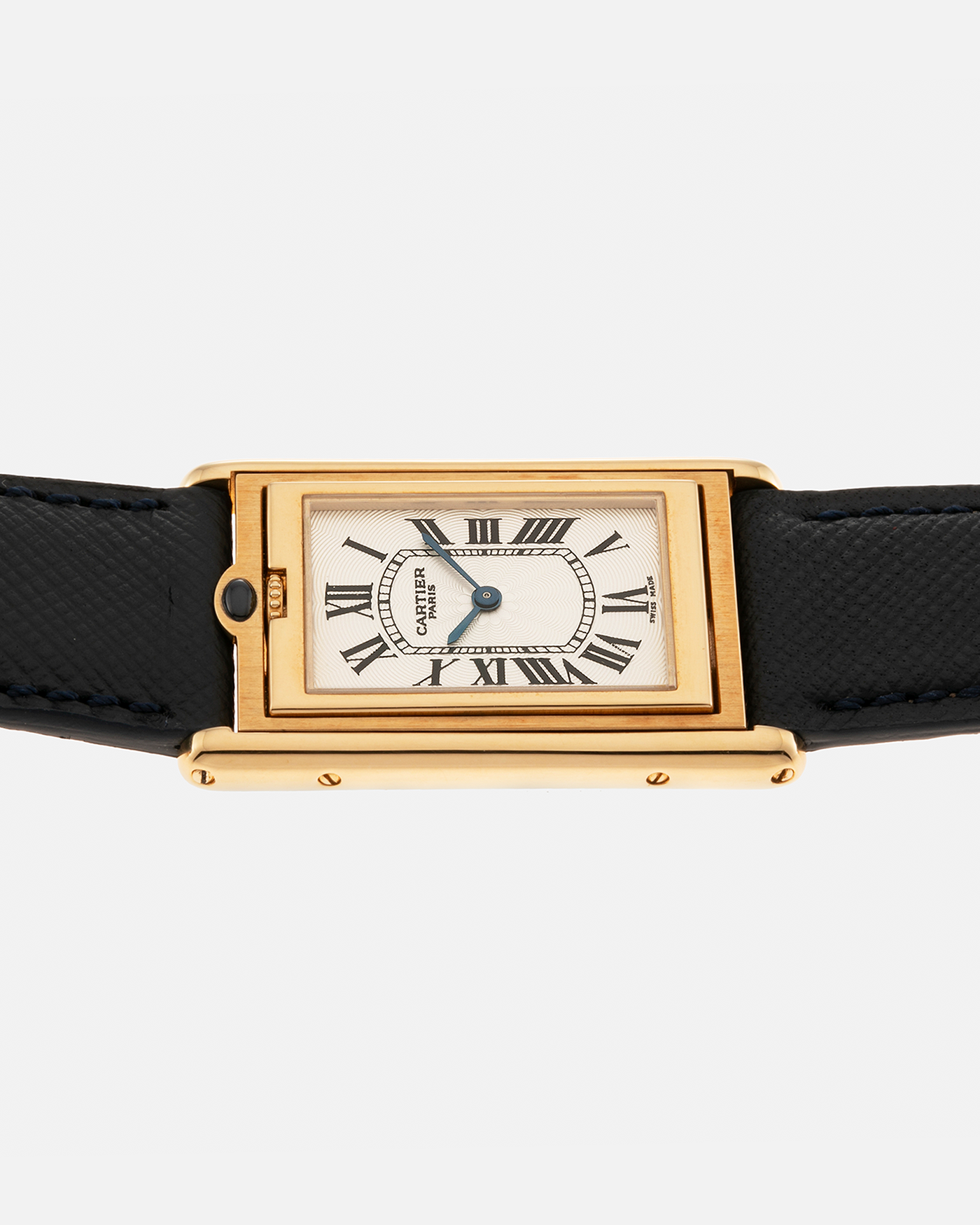 Brand: Cartier Year: 2000s Model: Collection Privée Cartier Paris Tank Basculante Material: 18-carat Yellow Gold Movement: Cartier Cal. 060MC (F. Piguet Cal. 610), Manual-Winding Case Diameter: 25mm x 39mm Lug Width: 20mm Strap: Nostime Navy Textured Calf Leather Strap with Signed 18-carat Yellow Gold Deployant Clasp, additional Cartier Brown Textured Calf Leather Strap (Used)