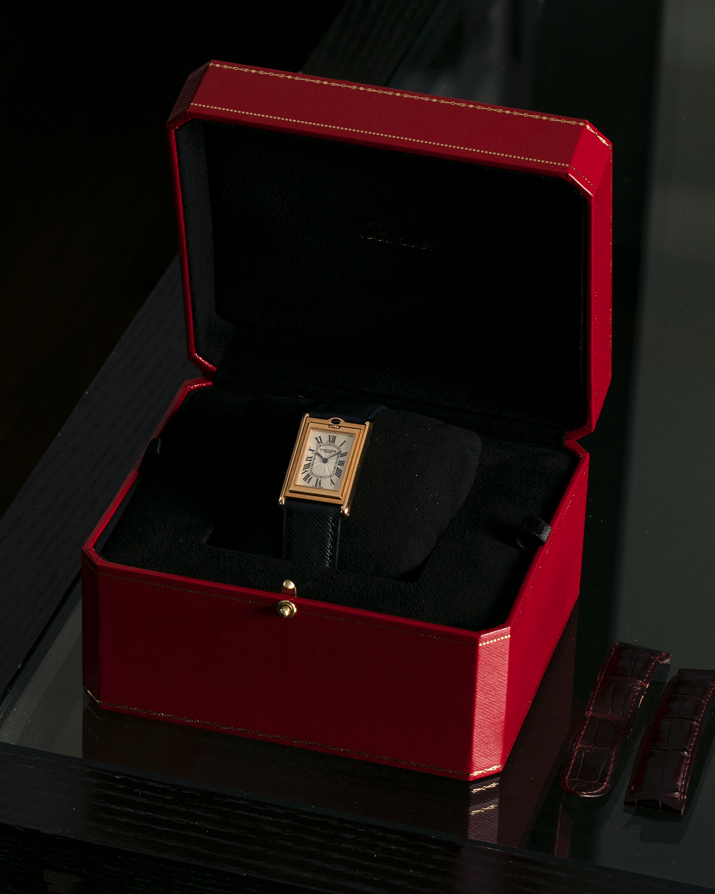 Brand: Cartier Year: 2000s Model: Collection Privée Cartier Paris Tank Basculante Material: 18-carat Yellow Gold Movement: Cartier Cal. 060MC (F. Piguet Cal. 610), Manual-Winding Case Diameter: 25mm x 39mm Lug Width: 20mm Strap: Nostime Navy Textured Calf Leather Strap with Signed 18-carat Yellow Gold Deployant Clasp, additional Cartier Brown Textured Calf Leather Strap (Used)