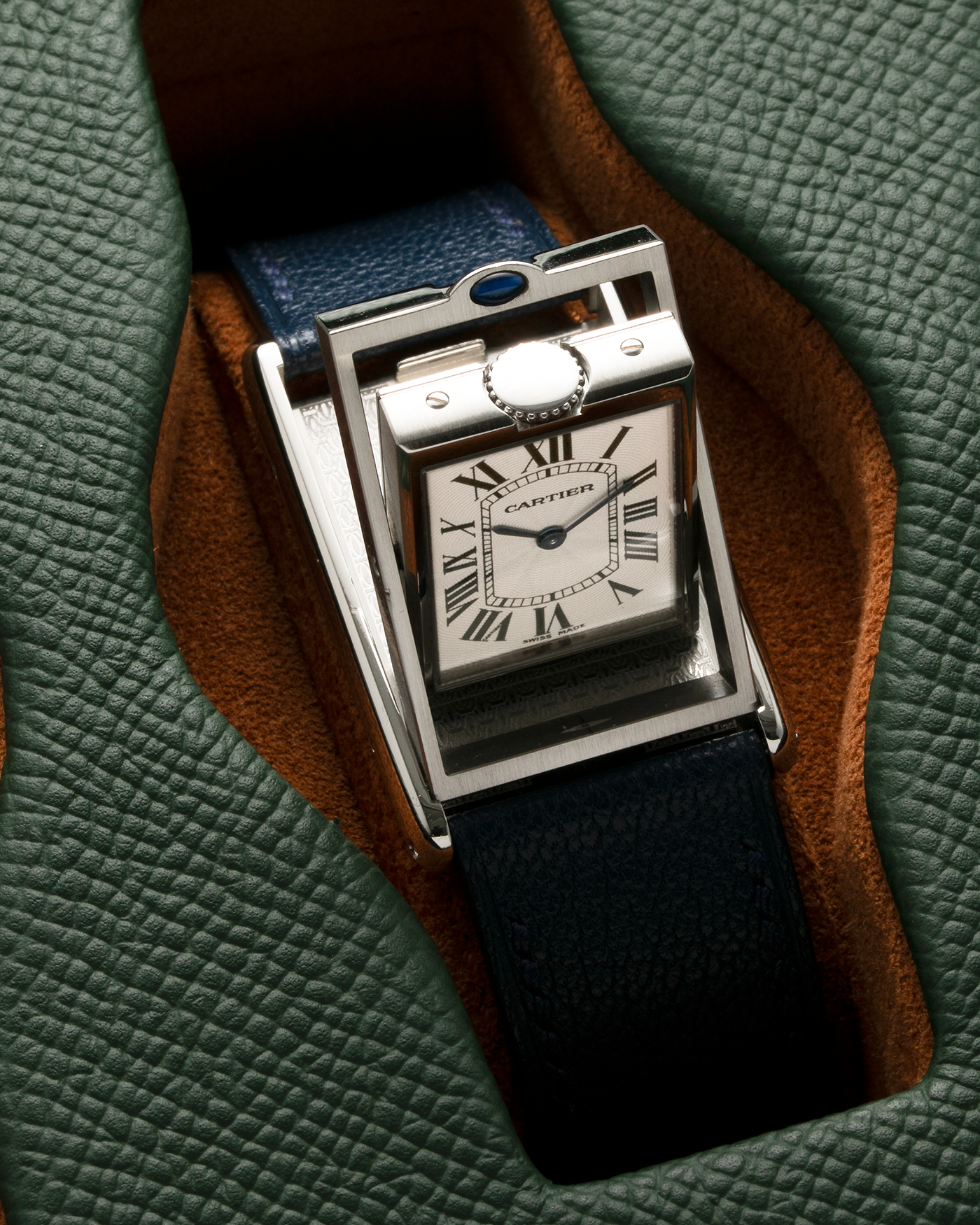 Brand: Cartier Year: 1990’s Model: Tank Basculante Reference: 2390 Material: Stainless Steel Movement: Piguet-derived Cartier Cal. 050 MC, Manual-Winding Case Diameter: 26mm x 38mm Strap: Alexandre Ritz Navy Blue Calf Leather Strap with Signed Stainless Steel Tang Buckle