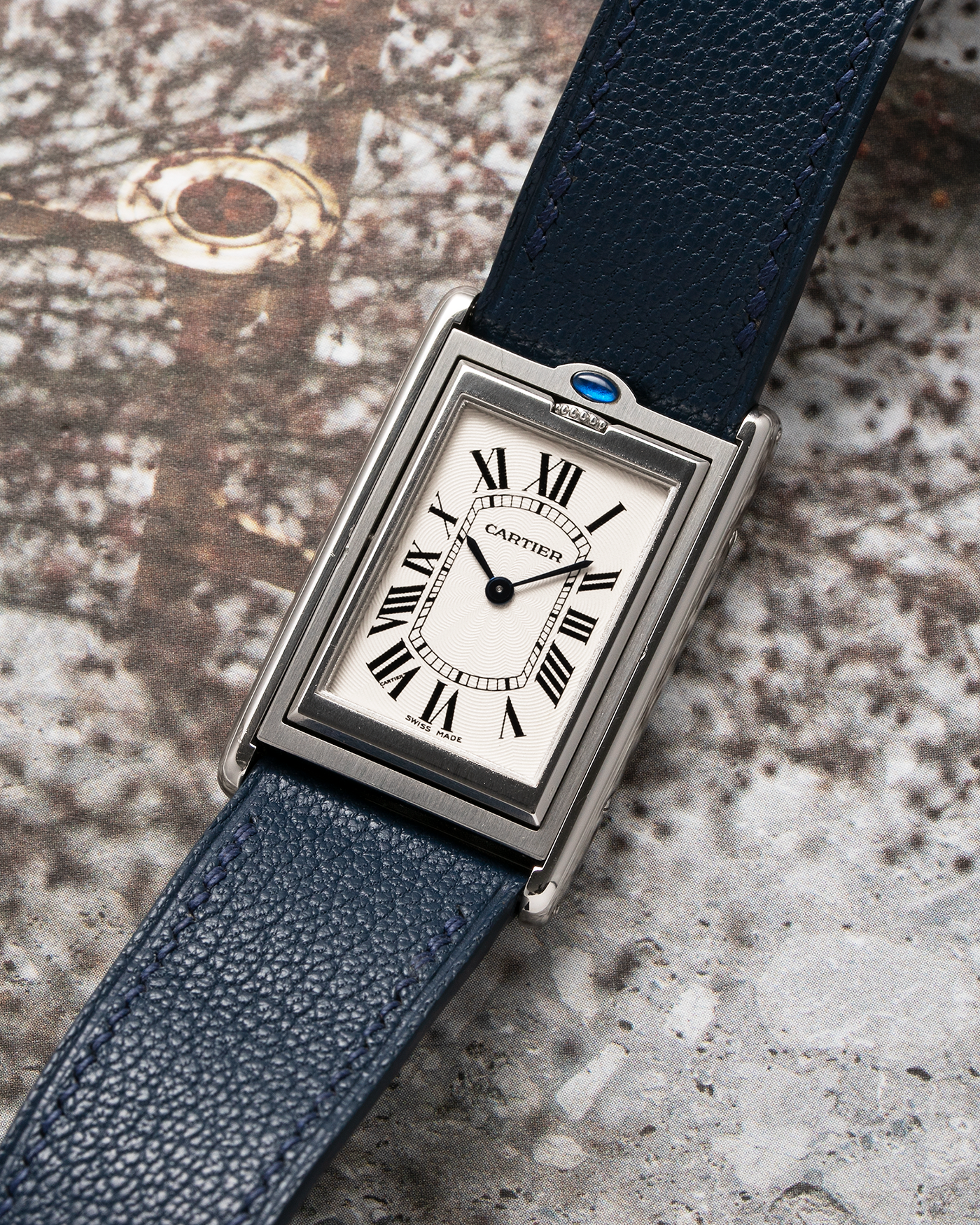 Brand: Cartier Year: 1990’s Model: Tank Basculante Reference: 2390 Material: Stainless Steel Movement: Piguet-derived Cartier Cal. 050 MC, Manual-Winding Case Diameter: 26mm x 38mm Strap: Alexandre Ritz Navy Blue Calf Leather Strap with Signed Stainless Steel Tang Buckle
