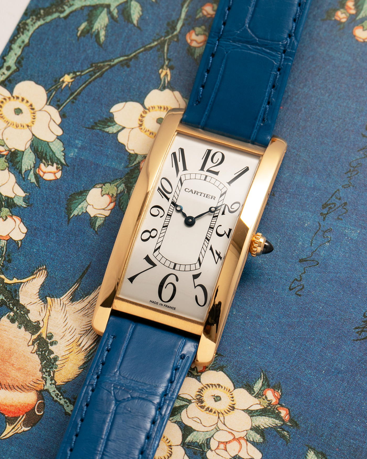 Brand: Cartier
Year: 2000s
Model: Collection Privée Cartier Paris Tank Cintrée, Limited to 150 pieces
Reference: 2718
Material: 18-carat Yellow Gold
Movement: Cartier Cal. 8780 MC (Based on JLC Cal. 849), Manual-Winding
Case Dimensions: 46mm (Including Lugs) x 23 mm x 6.4mm
Lug Width: 16mm
Strap: Cartier Cobalt Blue Alligator Leather Strap with Signed 18-carat Yellow Gold Deployant Clasp