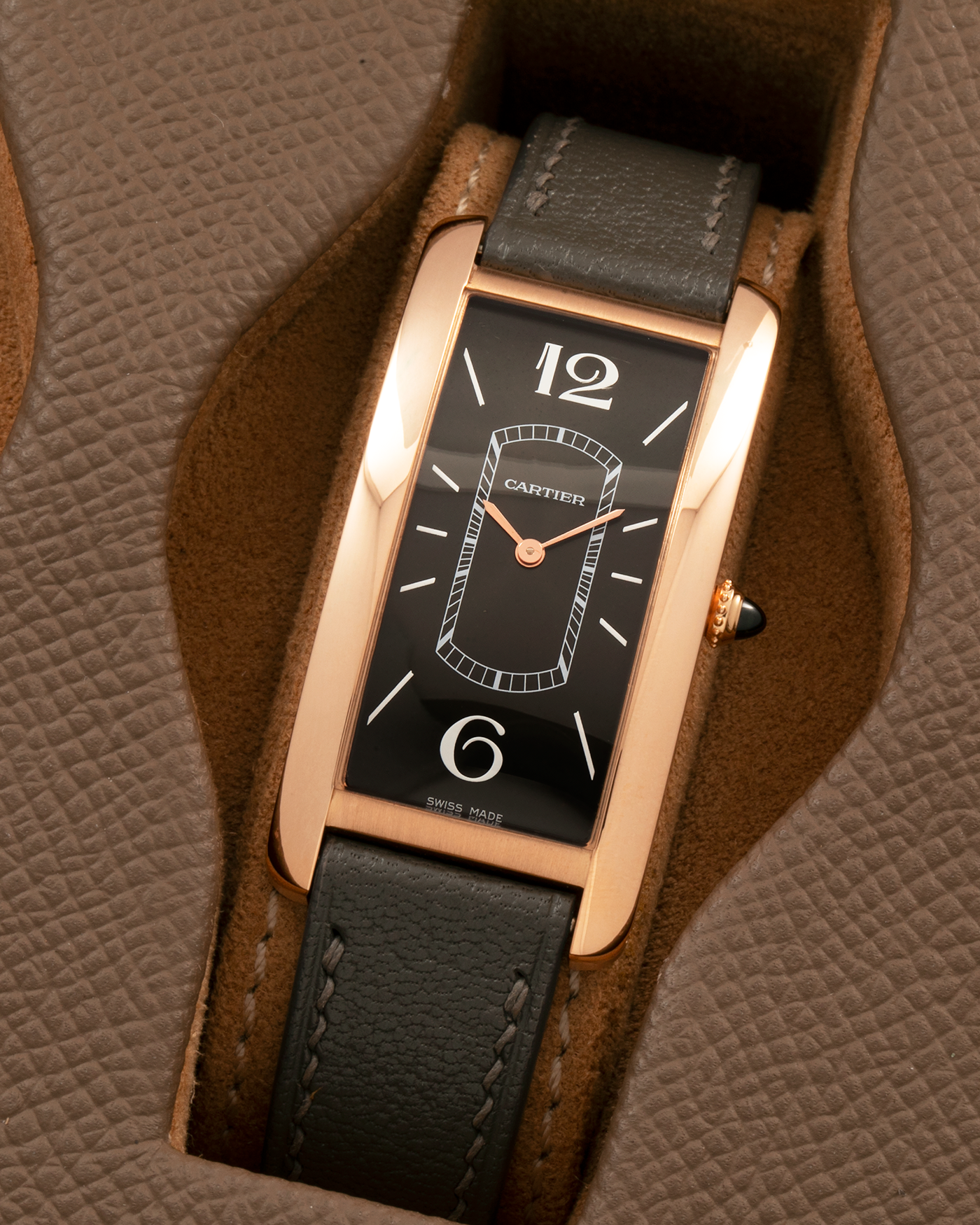 Brand: Cartier Year: 2021 Model: Tank Cintrée Reference: WGTA0025 Material: 18-carat Rose Gold Movement: Cartier Cal. 8971 MC (Based on JLC Cal. 846), Manual-Winding Case Diameter: 46.3mm x 23 mm Lug Width: 16mm Strap: Semi-Matt Grey Leather Strap with Signed 18-carat Rose Gold Tang Buckle