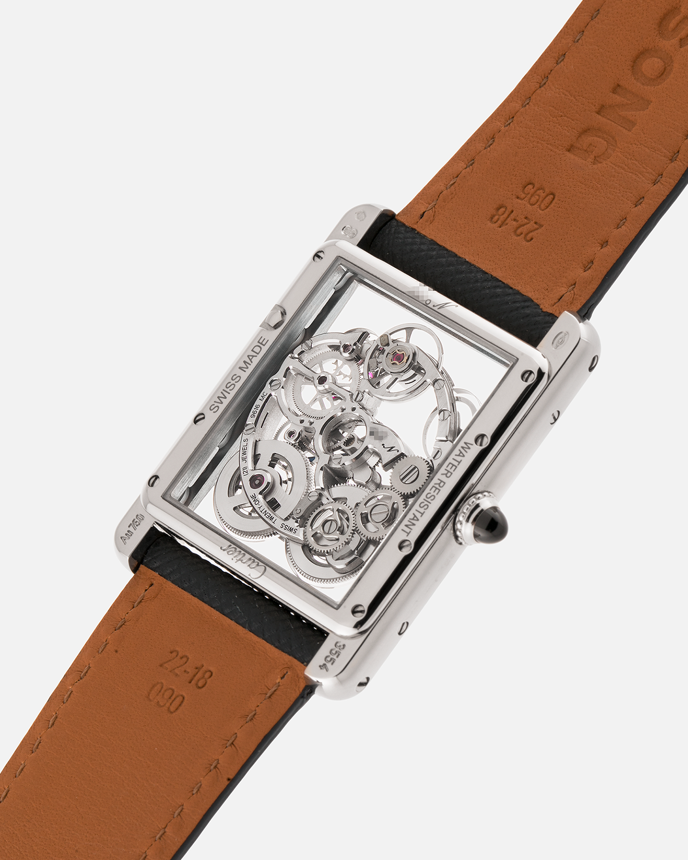 Brand: Cartier
Year: 2015
Model: Tank Louis Cartier Sapphire Skeleton
Reference: W5310012
Material: 18k White Gold
Movement: Manual-Winding Cartier Calibre 9616 MC
Case Dimensions: 39.2mm by 30mm, 7.45mm Thickness
Strap: Navy Blue Molequin Textured Calf Strap, Grey Blue Cartier Alligator Strap, Sealed Black Cartier Alligator Strap with 18k White Gold Cartier Deployant Buckle