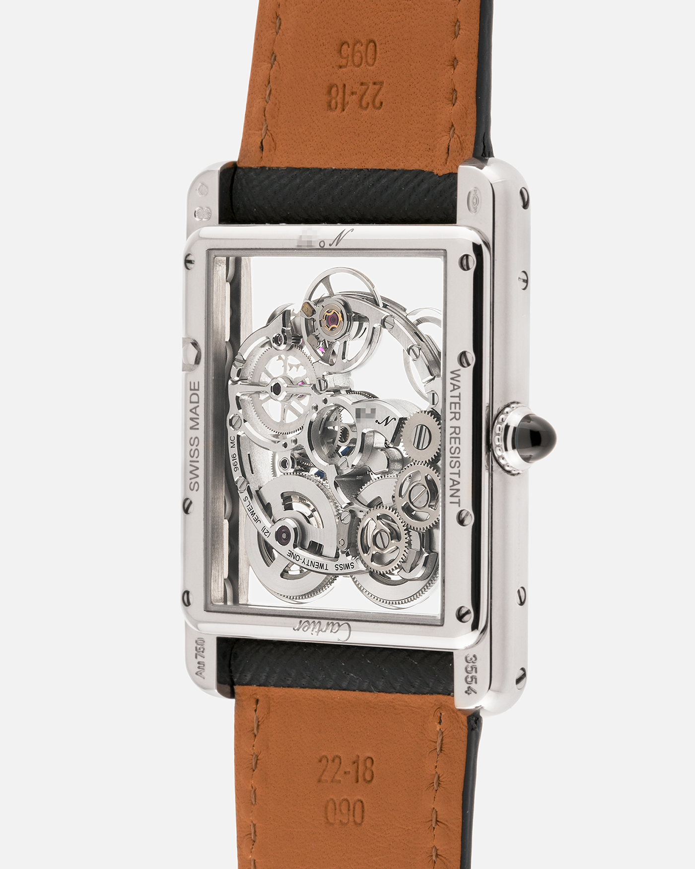 Brand: Cartier
Year: 2015
Model: Tank Louis Cartier Sapphire Skeleton
Reference: W5310012
Material: 18k White Gold
Movement: Manual-Winding Cartier Calibre 9616 MC
Case Dimensions: 39.2mm by 30mm, 7.45mm Thickness
Strap: Navy Blue Molequin Textured Calf Strap, Grey Blue Cartier Alligator Strap, Sealed Black Cartier Alligator Strap with 18k White Gold Cartier Deployant Buckle