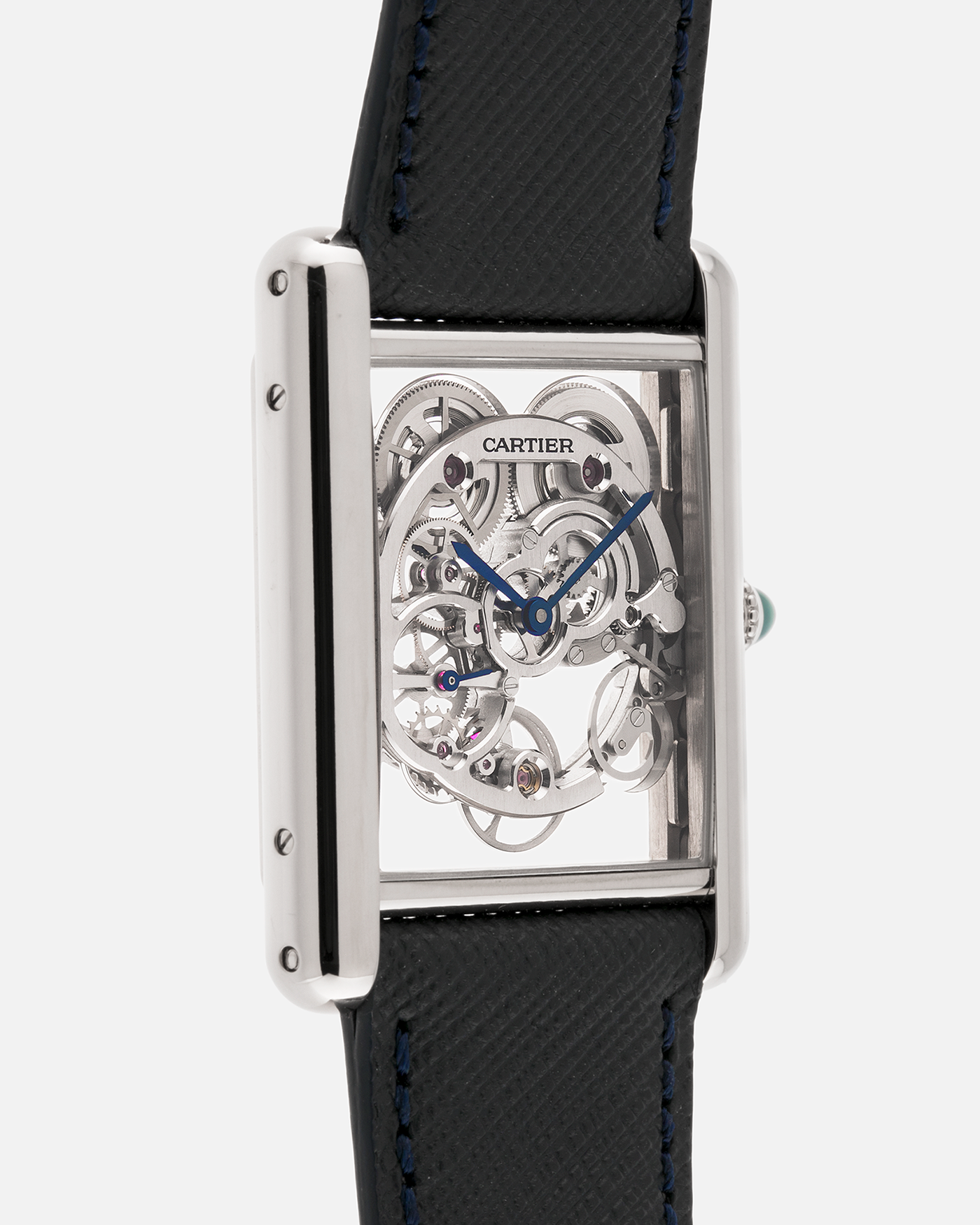 Brand: Cartier
Year: 2015
Model: Tank Louis Cartier Sapphire Skeleton
Reference: W5310012
Material: 18k White Gold
Movement: Manual-Winding Cartier Calibre 9616 MC
Case Dimensions: 39.2mm by 30mm, 7.45mm Thickness
Strap: Navy Blue Molequin Textured Calf Strap, Grey Blue Cartier Alligator Strap, Sealed Black Cartier Alligator Strap with 18k White Gold Cartier Deployant Buckle