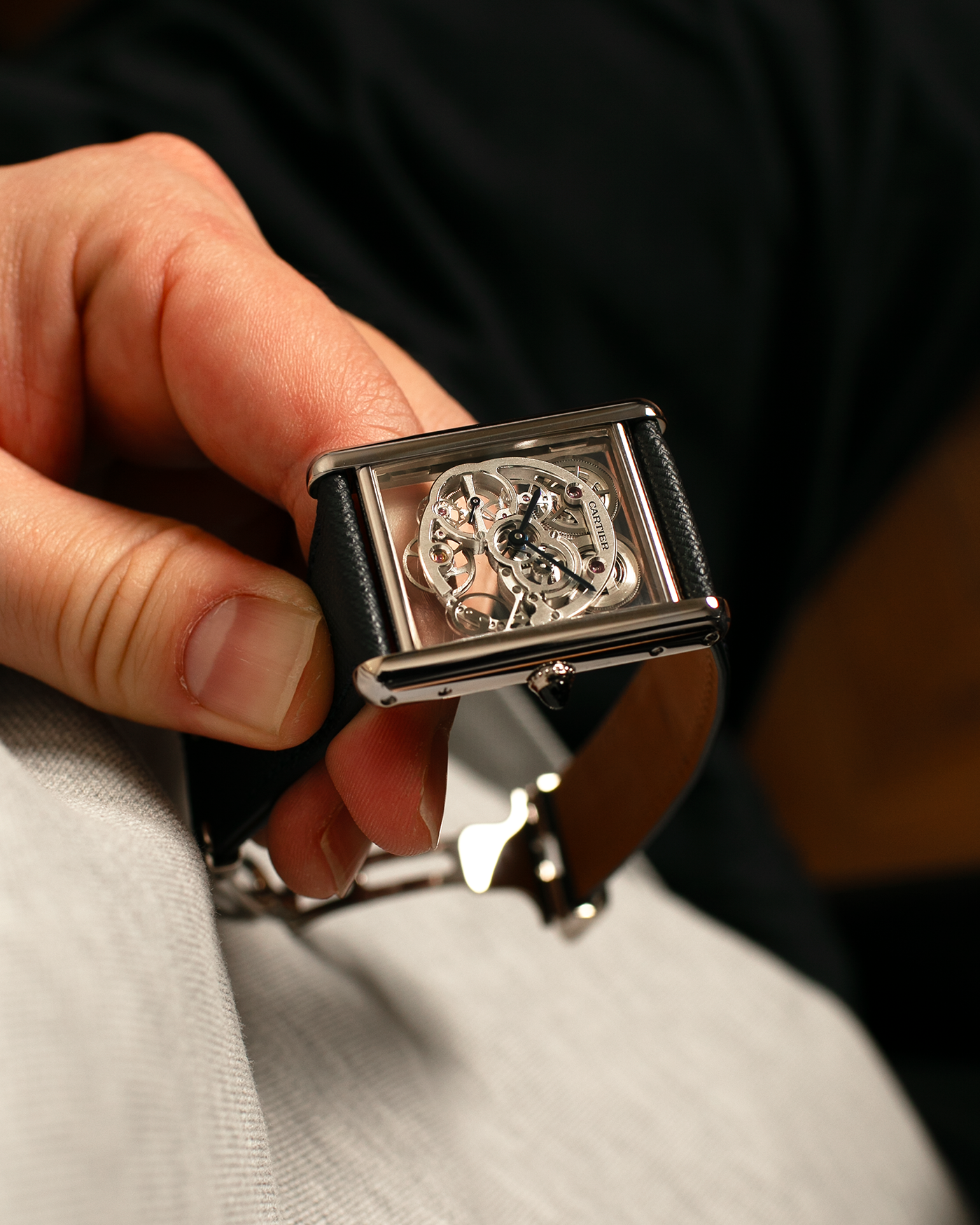 Brand: Cartier
Year: 2015
Model: Tank Louis Cartier Sapphire Skeleton
Reference: W5310012
Material: 18k White Gold
Movement: Manual-Winding Cartier Calibre 9616 MC
Case Dimensions: 39.2mm by 30mm, 7.45mm Thickness
Strap: Navy Blue Molequin Textured Calf Strap, Grey Blue Cartier Alligator Strap, Sealed Black Cartier Alligator Strap with 18k White Gold Cartier Deployant Buckle