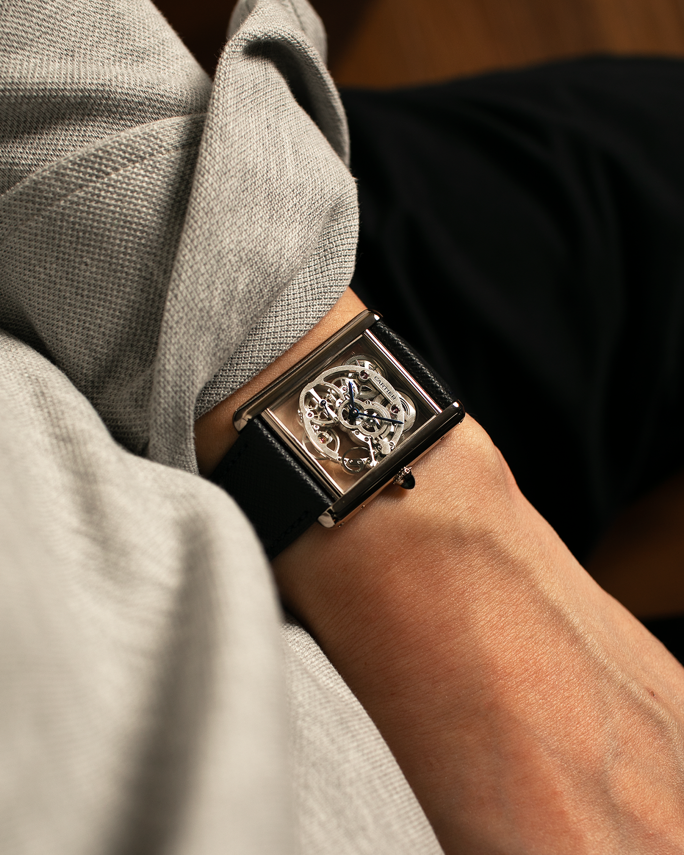 Brand: Cartier
Year: 2015
Model: Tank Louis Cartier Sapphire Skeleton
Reference: W5310012
Material: 18k White Gold
Movement: Manual-Winding Cartier Calibre 9616 MC
Case Dimensions: 39.2mm by 30mm, 7.45mm Thickness
Strap: Navy Blue Molequin Textured Calf Strap, Grey Blue Cartier Alligator Strap, Sealed Black Cartier Alligator Strap with 18k White Gold Cartier Deployant Buckle