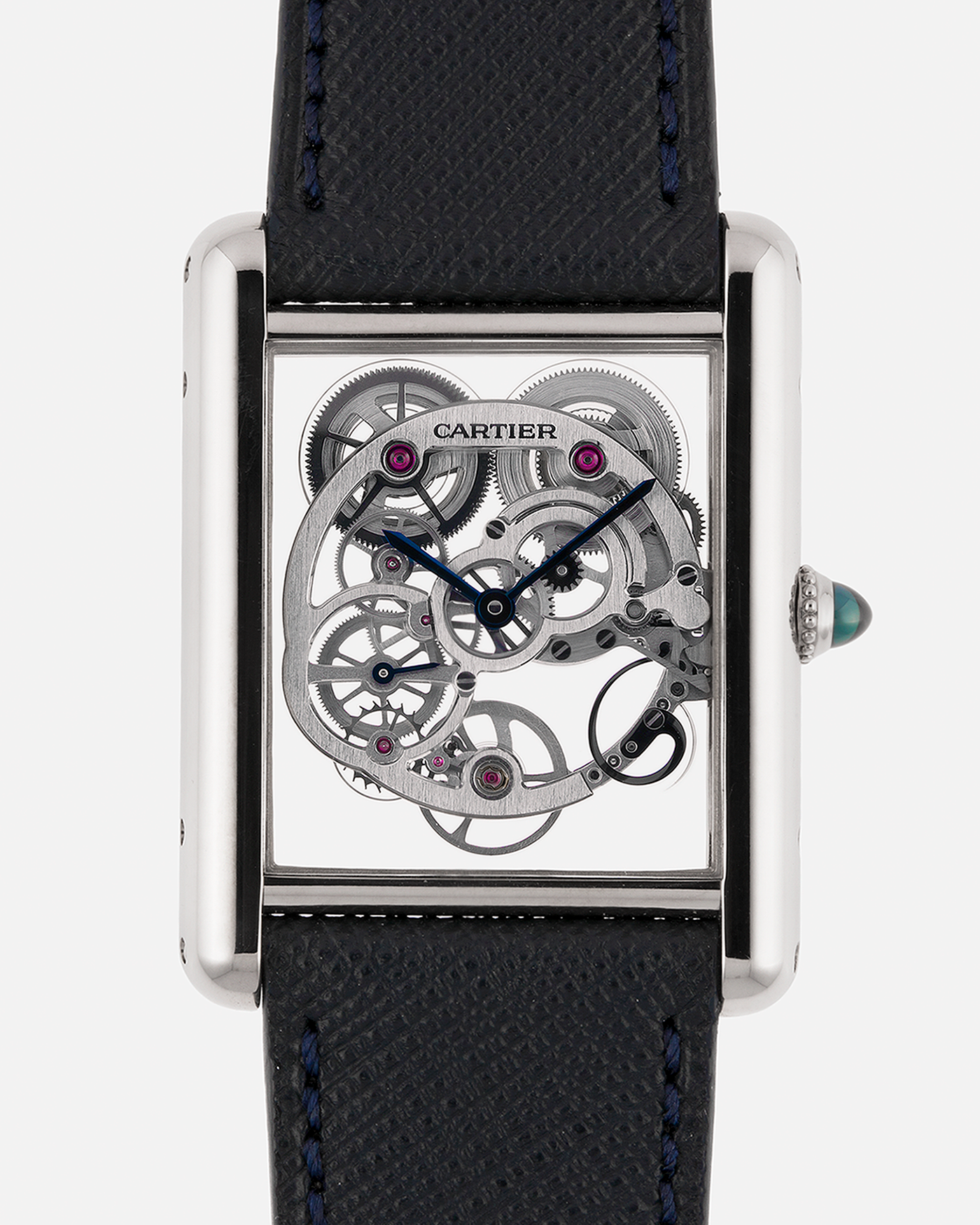Brand: Cartier
Year: 2015
Model: Tank Louis Cartier Sapphire Skeleton
Reference: W5310012
Material: 18k White Gold
Movement: Manual-Winding Cartier Calibre 9616 MC
Case Dimensions: 39.2mm by 30mm, 7.45mm Thickness
Strap: Navy Blue Molequin Textured Calf Strap, Grey Blue Cartier Alligator Strap, Sealed Black Cartier Alligator Strap with 18k White Gold Cartier Deployant Buckle