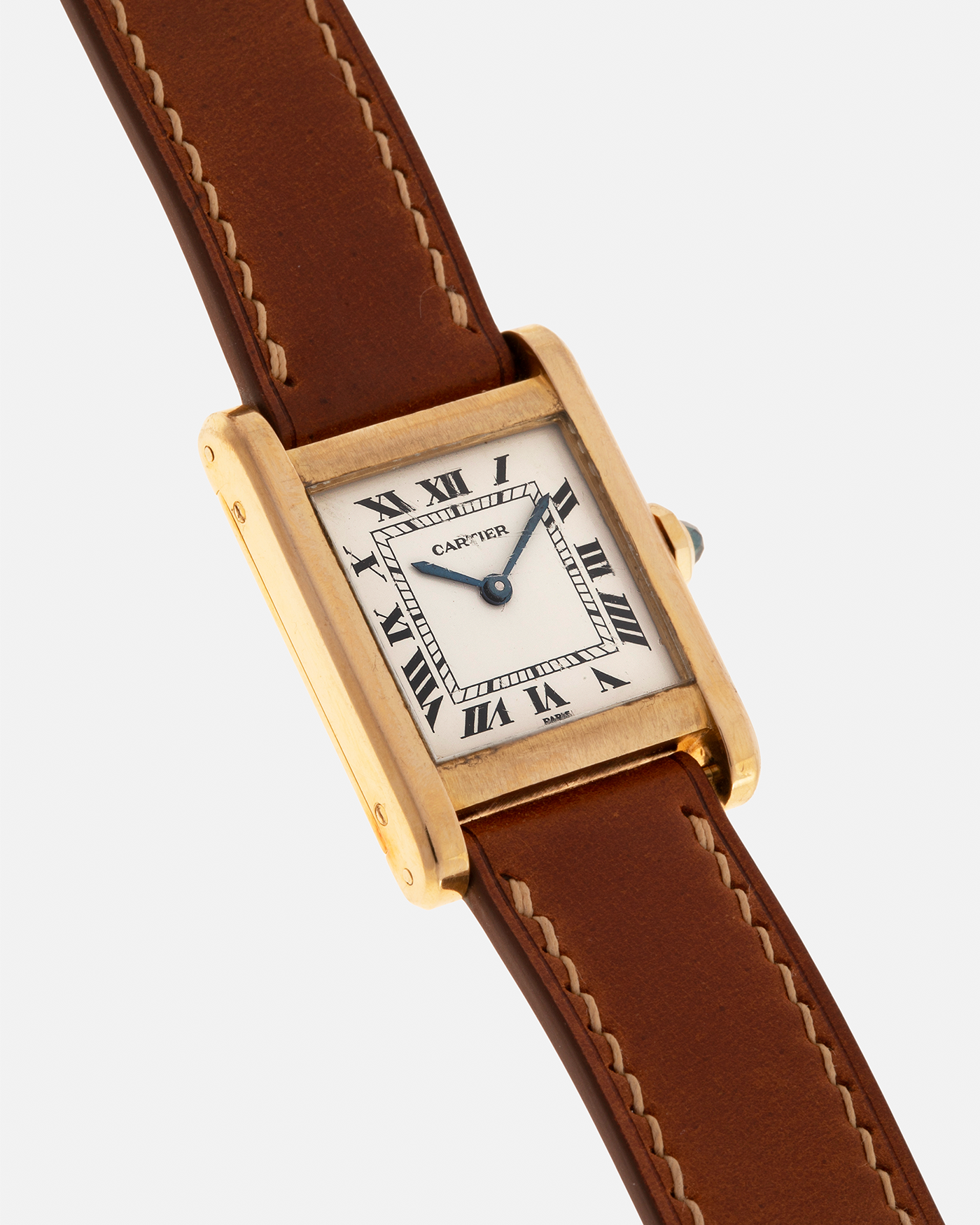 Brand: Cartier
Year: 1976
Model: Tank Normale
Reference Number: 78092
Material: 18-carat Yellow Gold
Movement: Cartier Cal. 78-1, Manual-Winding
Case Diameter: 30mm (Lug-to-Lug) x 22mm x 6.6mm
Lug Width: 17mm
Strap: Custom Tanned Brown Calf Leather Strap with Signed 18-carat Yellow Gold ‘London’ Deployant Clasp