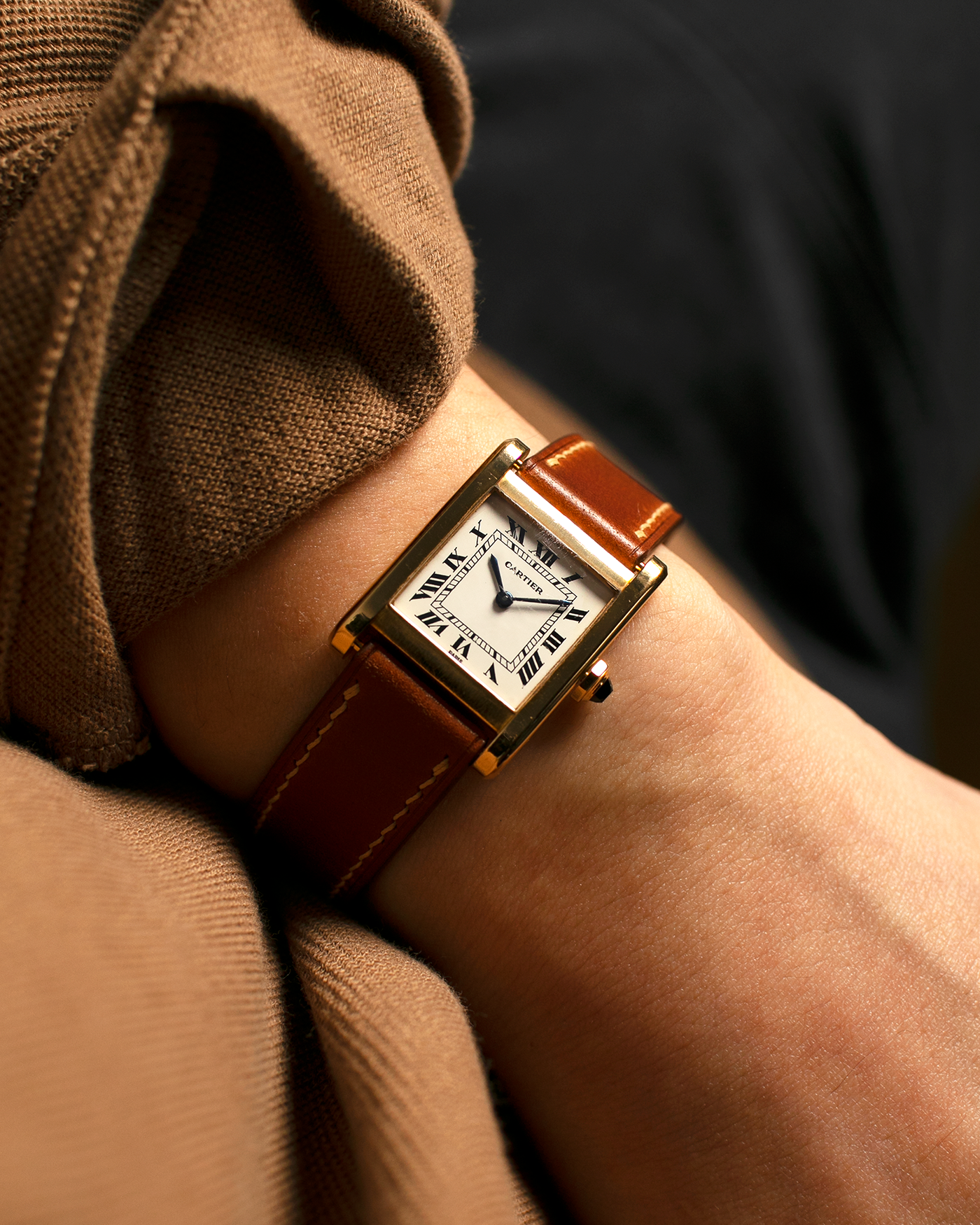 Brand: Cartier
Year: 1976
Model: Tank Normale
Reference Number: 78092
Material: 18-carat Yellow Gold
Movement: Cartier Cal. 78-1, Manual-Winding
Case Diameter: 30mm (Lug-to-Lug) x 22mm x 6.6mm
Lug Width: 17mm
Strap: Custom Tanned Brown Calf Leather Strap with Signed 18-carat Yellow Gold ‘London’ Deployant Clasp