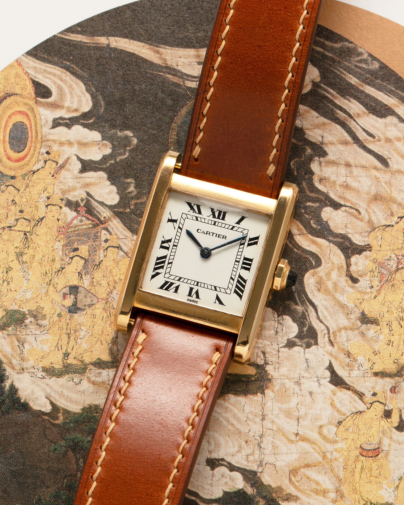 Brand: Cartier
Year: 1976
Model: Tank Normale
Reference Number: 78092
Material: 18-carat Yellow Gold
Movement: Cartier Cal. 78-1, Manual-Winding
Case Diameter: 30mm (Lug-to-Lug) x 22mm x 6.6mm
Lug Width: 17mm
Strap: Custom Tanned Brown Calf Leather Strap with Signed 18-carat Yellow Gold ‘London’ Deployant Clasp