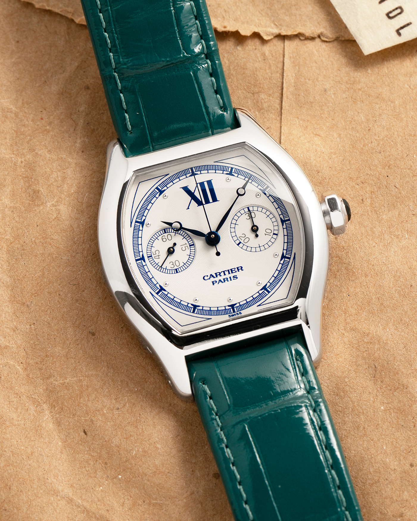 Brand: Cartier
Year: 2000’s
Model: Collection Privée Cartier Paris Tortue Monopoussoir
Reference: 2396
Material: 18k White Gold
Movement: Cartier THA Cal. 045MC, Manual-Winding
Case Diameter: 43mm X 34mm
Lug Width: 18mm
Strap: Cartier Teal Alligator Leather Strap with Cartier 18-carat White Gold Deployant Clasp
