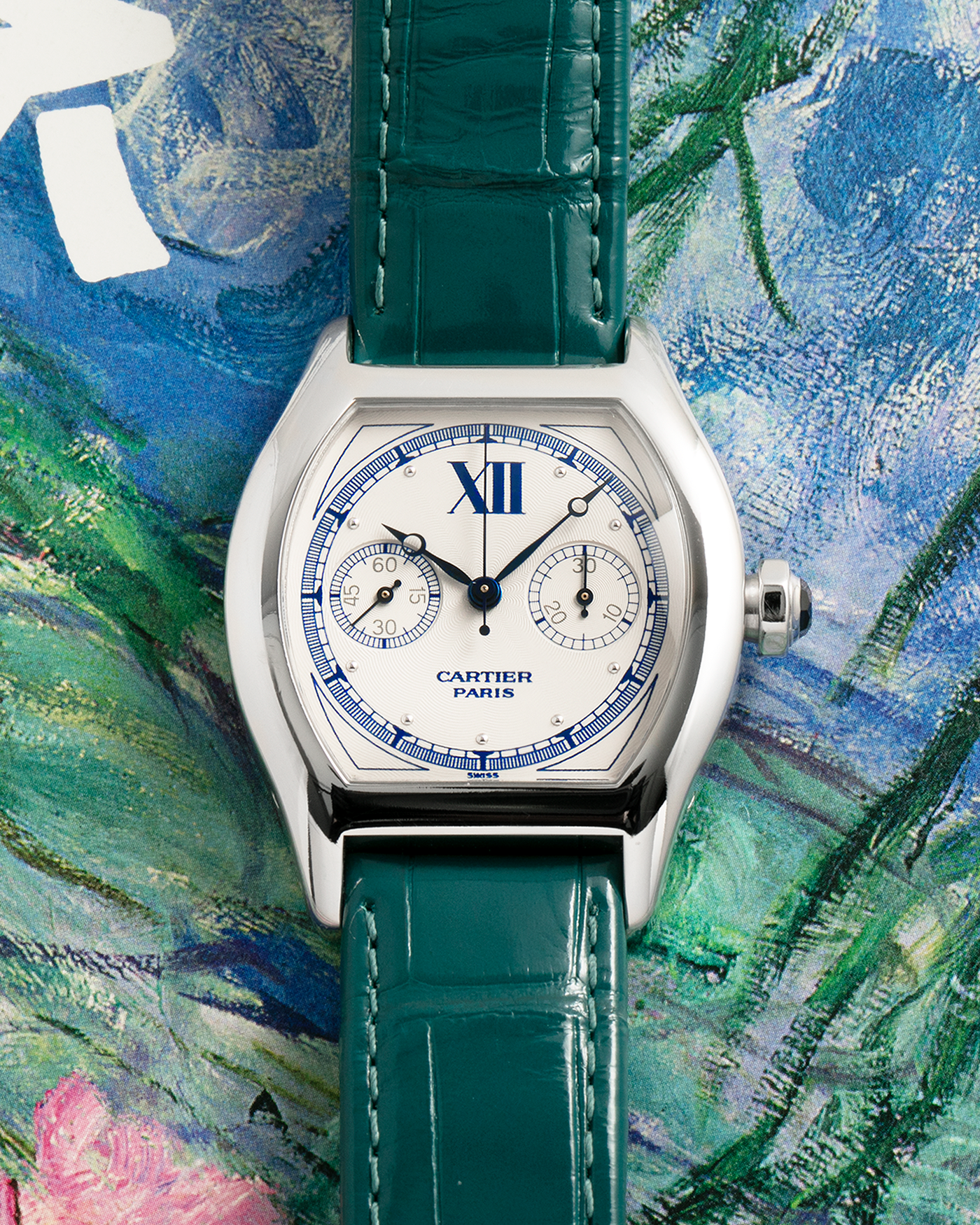 Brand: Cartier
Year: 2000’s
Model: Collection Privée Cartier Paris Tortue Monopoussoir
Reference: 2396
Material: 18k White Gold
Movement: Cartier THA Cal. 045MC, Manual-Winding
Case Diameter: 43mm X 34mm
Lug Width: 18mm
Strap: Cartier Teal Alligator Leather Strap with Cartier 18-carat White Gold Deployant Clasp