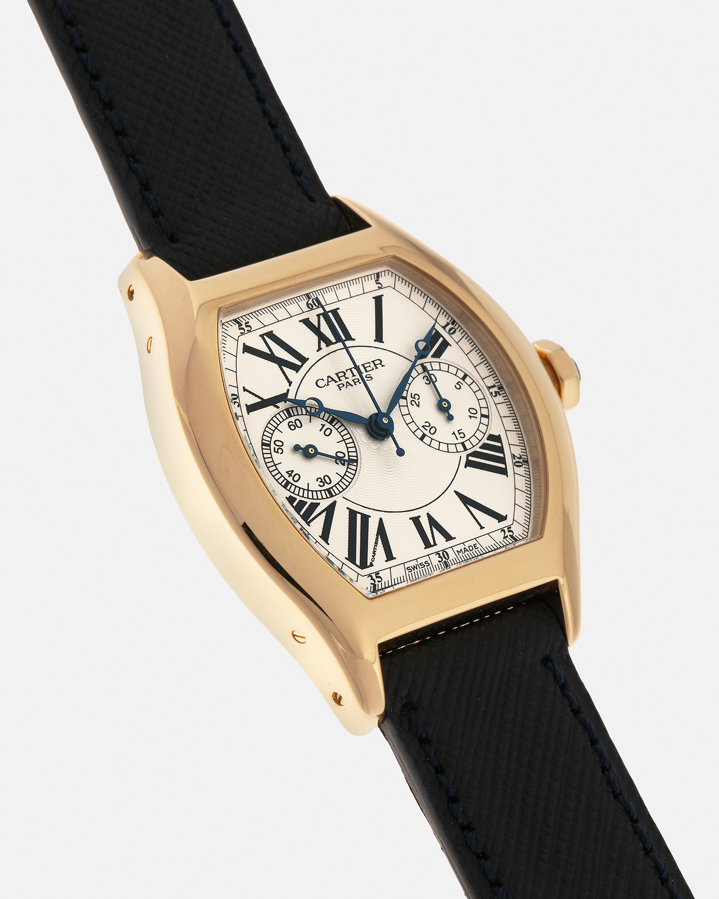 Brand: Cartier
Year: 2008
Model: Collection Privée Cartier Paris Tortue Monopoussoir
Reference: 2356
Material: 18-carat Yellow Gold
Movement: Cartier THA Cal. 045MC, Manual-Winding
Case Diameter: 43mm (Lug-to-Lug) x 35 mm
Lug Width: 18mm
Strap: Molequin Navy Blue Textured Calf Leather with Signed 18-carat Yellow Gold Deployant Clasp, with additional Cartier Green Alligator Leather Strap