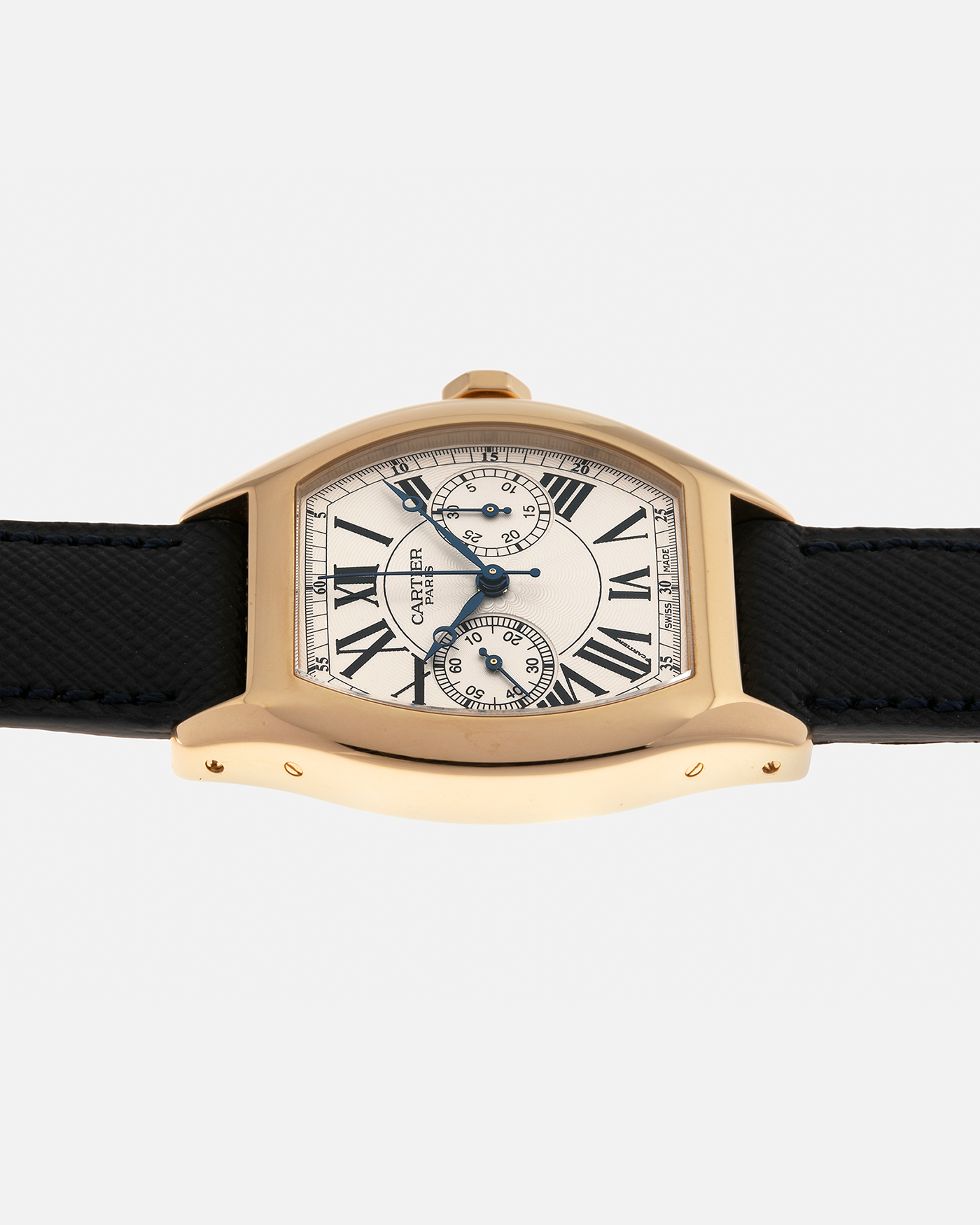 Brand: Cartier
Year: 2008
Model: Collection Privée Cartier Paris Tortue Monopoussoir
Reference: 2356
Material: 18-carat Yellow Gold
Movement: Cartier THA Cal. 045MC, Manual-Winding
Case Diameter: 43mm (Lug-to-Lug) x 35 mm
Lug Width: 18mm
Strap: Molequin Navy Blue Textured Calf Leather with Signed 18-carat Yellow Gold Deployant Clasp, with additional Cartier Green Alligator Leather Strap