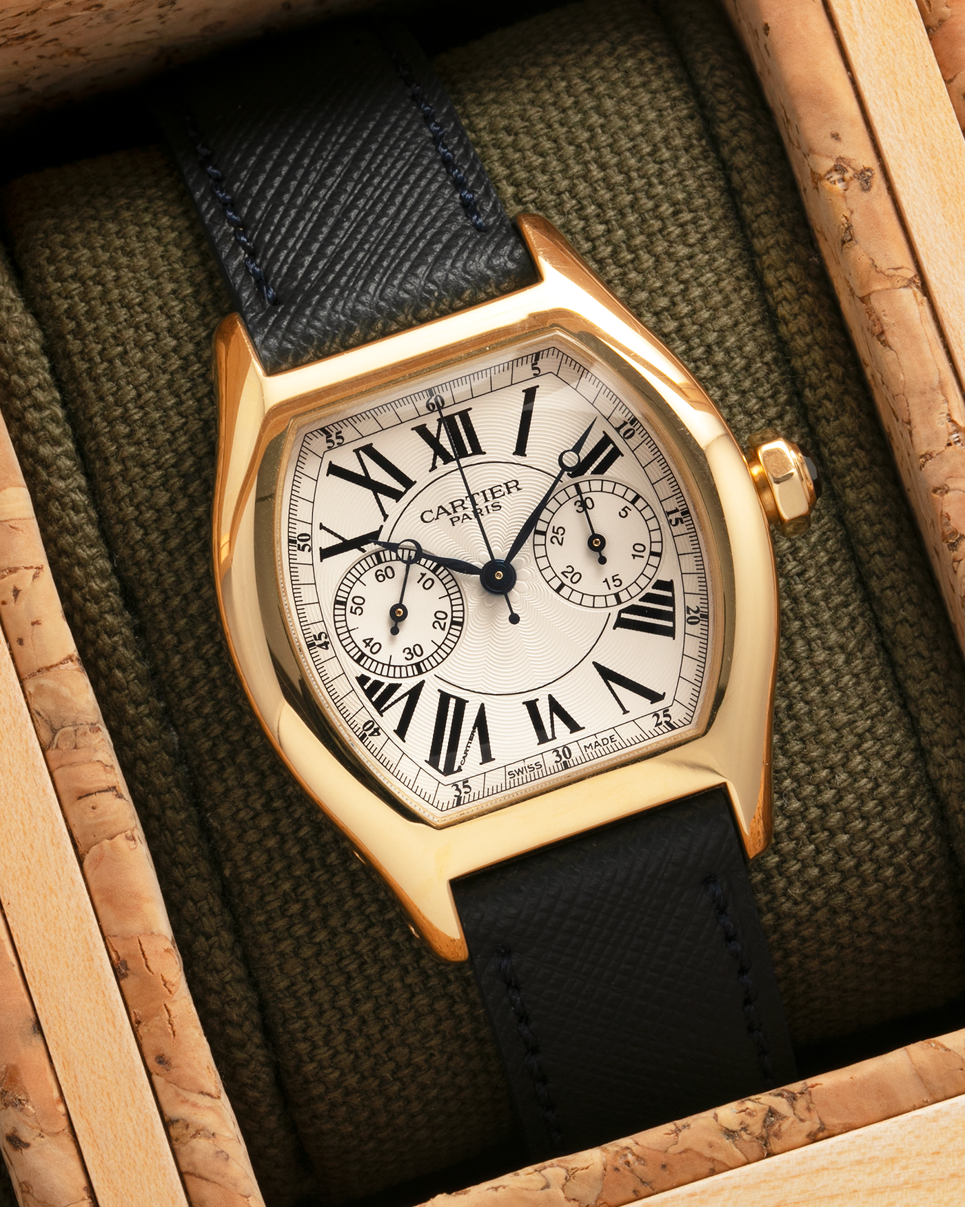 Brand: Cartier
Year: 2008
Model: Collection Privée Cartier Paris Tortue Monopoussoir
Reference: 2356
Material: 18-carat Yellow Gold
Movement: Cartier THA Cal. 045MC, Manual-Winding
Case Diameter: 43mm (Lug-to-Lug) x 35 mm
Lug Width: 18mm
Strap: Molequin Navy Blue Textured Calf Leather with Signed 18-carat Yellow Gold Deployant Clasp, with additional Cartier Green Alligator Leather Strap