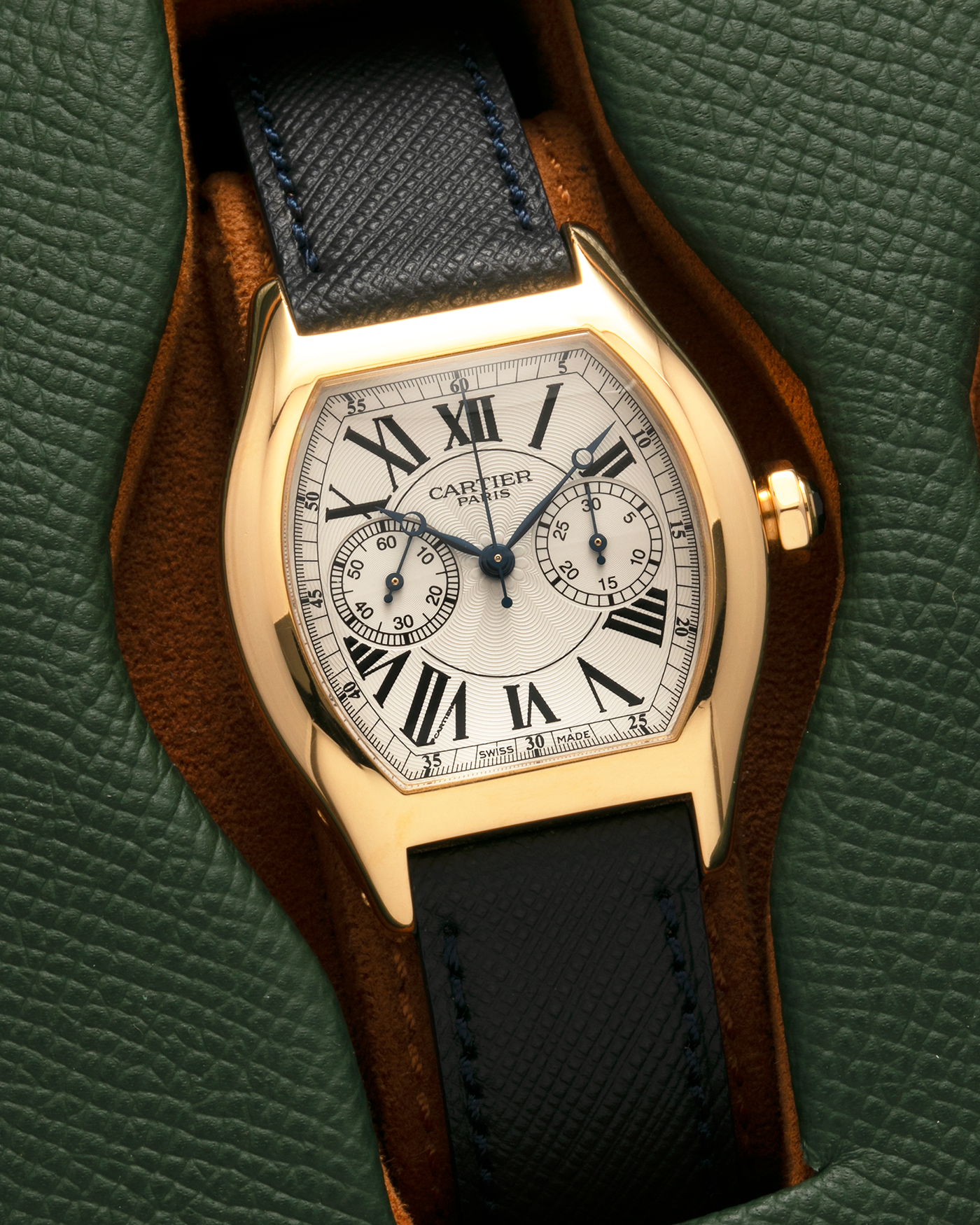 Brand: Cartier
Year: 2008
Model: Collection Privée Cartier Paris Tortue Monopoussoir
Reference: 2356
Material: 18-carat Yellow Gold
Movement: Cartier THA Cal. 045MC, Manual-Winding
Case Diameter: 43mm (Lug-to-Lug) x 35 mm
Lug Width: 18mm
Strap: Molequin Navy Blue Textured Calf Leather with Signed 18-carat Yellow Gold Deployant Clasp, with additional Cartier Green Alligator Leather Strap
