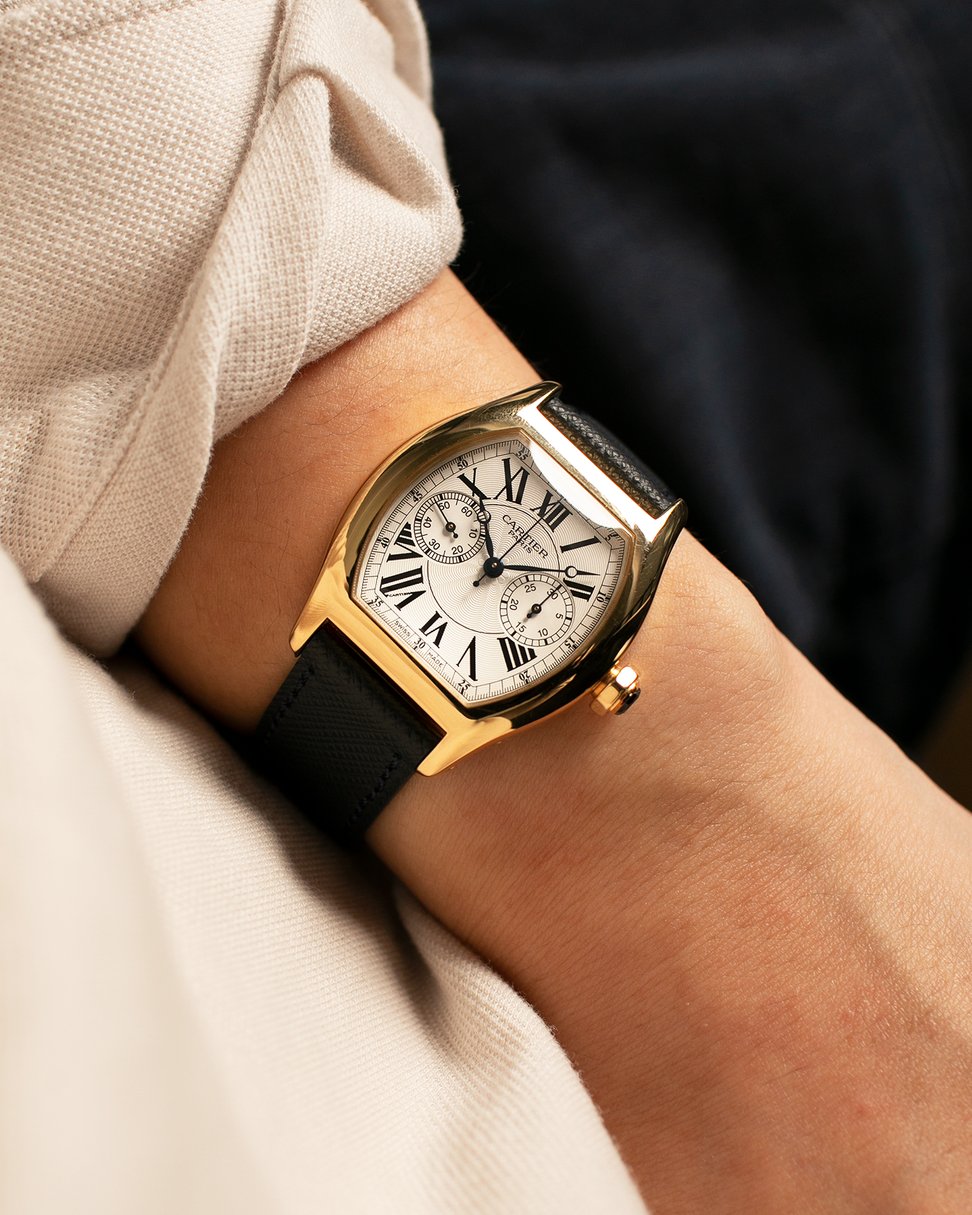 Brand: Cartier
Year: 2008
Model: Collection Privée Cartier Paris Tortue Monopoussoir
Reference: 2356
Material: 18-carat Yellow Gold
Movement: Cartier THA Cal. 045MC, Manual-Winding
Case Diameter: 43mm (Lug-to-Lug) x 35 mm
Lug Width: 18mm
Strap: Molequin Navy Blue Textured Calf Leather with Signed 18-carat Yellow Gold Deployant Clasp, with additional Cartier Green Alligator Leather Strap