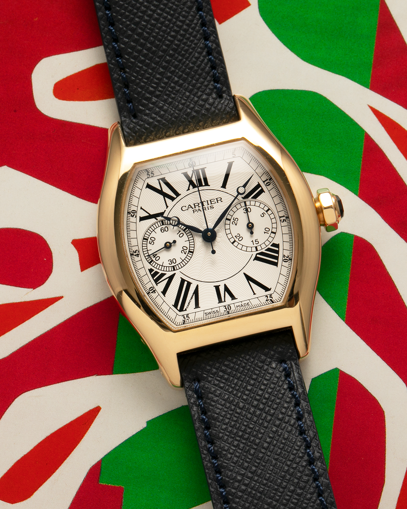 Brand: Cartier
Year: 2008
Model: Collection Privée Cartier Paris Tortue Monopoussoir
Reference: 2356
Material: 18-carat Yellow Gold
Movement: Cartier THA Cal. 045MC, Manual-Winding
Case Diameter: 43mm (Lug-to-Lug) x 35 mm
Lug Width: 18mm
Strap: Molequin Navy Blue Textured Calf Leather with Signed 18-carat Yellow Gold Deployant Clasp, with additional Cartier Green Alligator Leather Strap