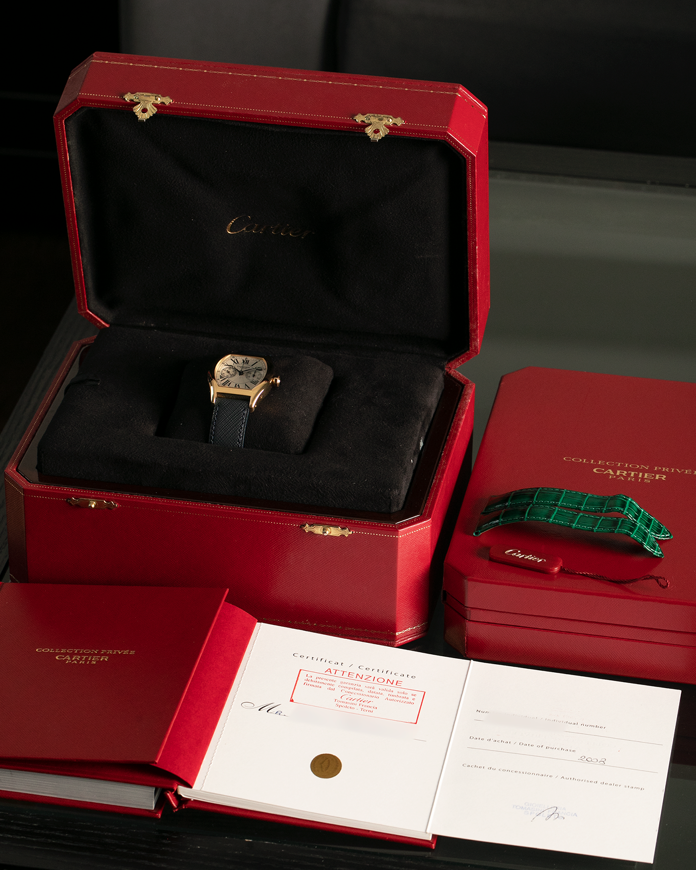 Brand: Cartier
Year: 2008
Model: Collection Privée Cartier Paris Tortue Monopoussoir
Reference: 2356
Material: 18-carat Yellow Gold
Movement: Cartier THA Cal. 045MC, Manual-Winding
Case Diameter: 43mm (Lug-to-Lug) x 35 mm
Lug Width: 18mm
Strap: Molequin Navy Blue Textured Calf Leather with Signed 18-carat Yellow Gold Deployant Clasp, with additional Cartier Green Alligator Leather Strap