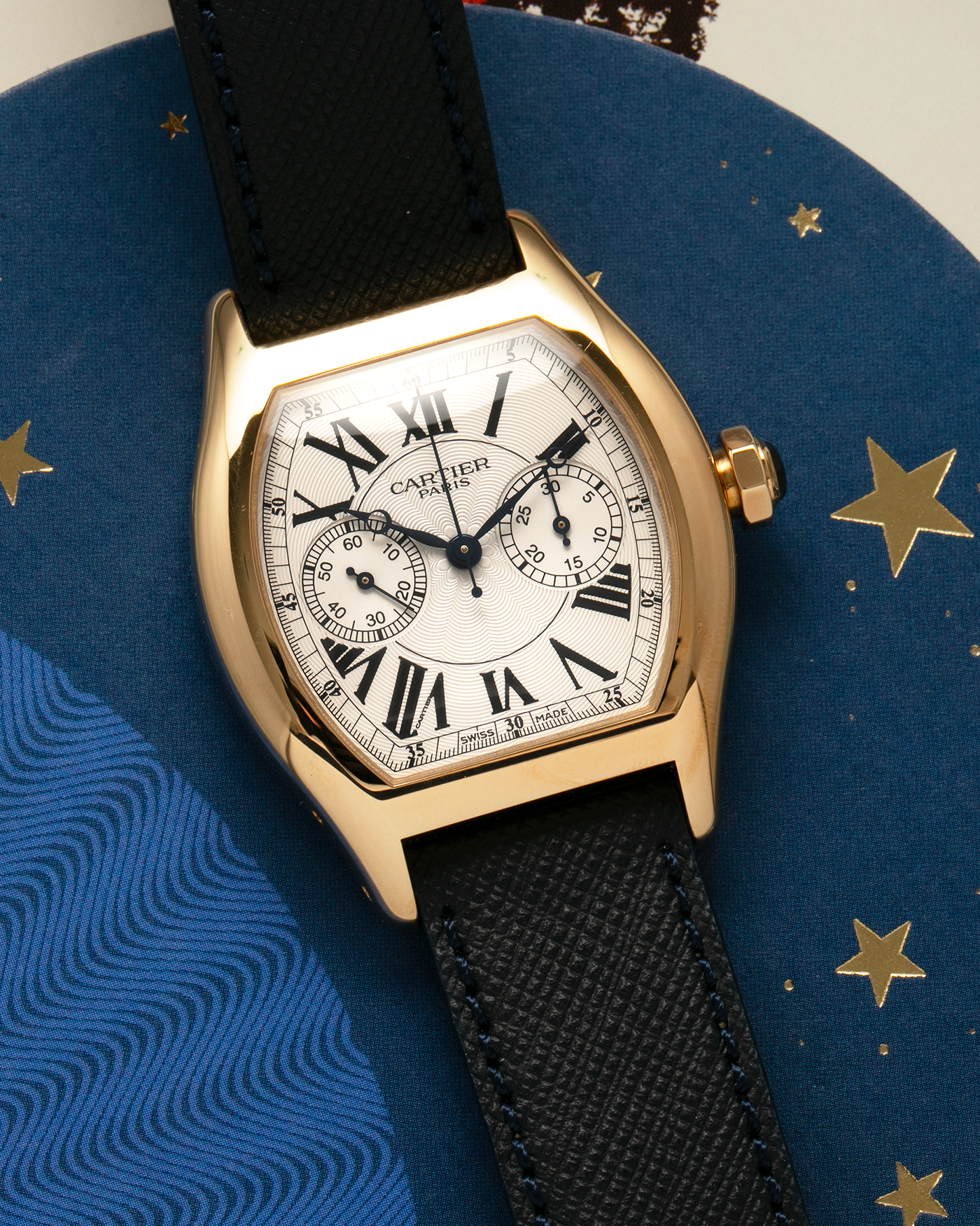 Brand: Cartier Year: 2000’s Model: Collection Privée Cartier Paris Tortue Monopoussoir Reference: 2356E Material: 18-carat Yellow Gold Movement: Cartier THA Cal. 045MC, Manual-Winding Case Diameter: 43mm x 35 mm Lug Width: 18mm Strap: Molequin Navy Blue Textured Calf Leather with Signed 18-carat Yellow Gold Deployant Clasp