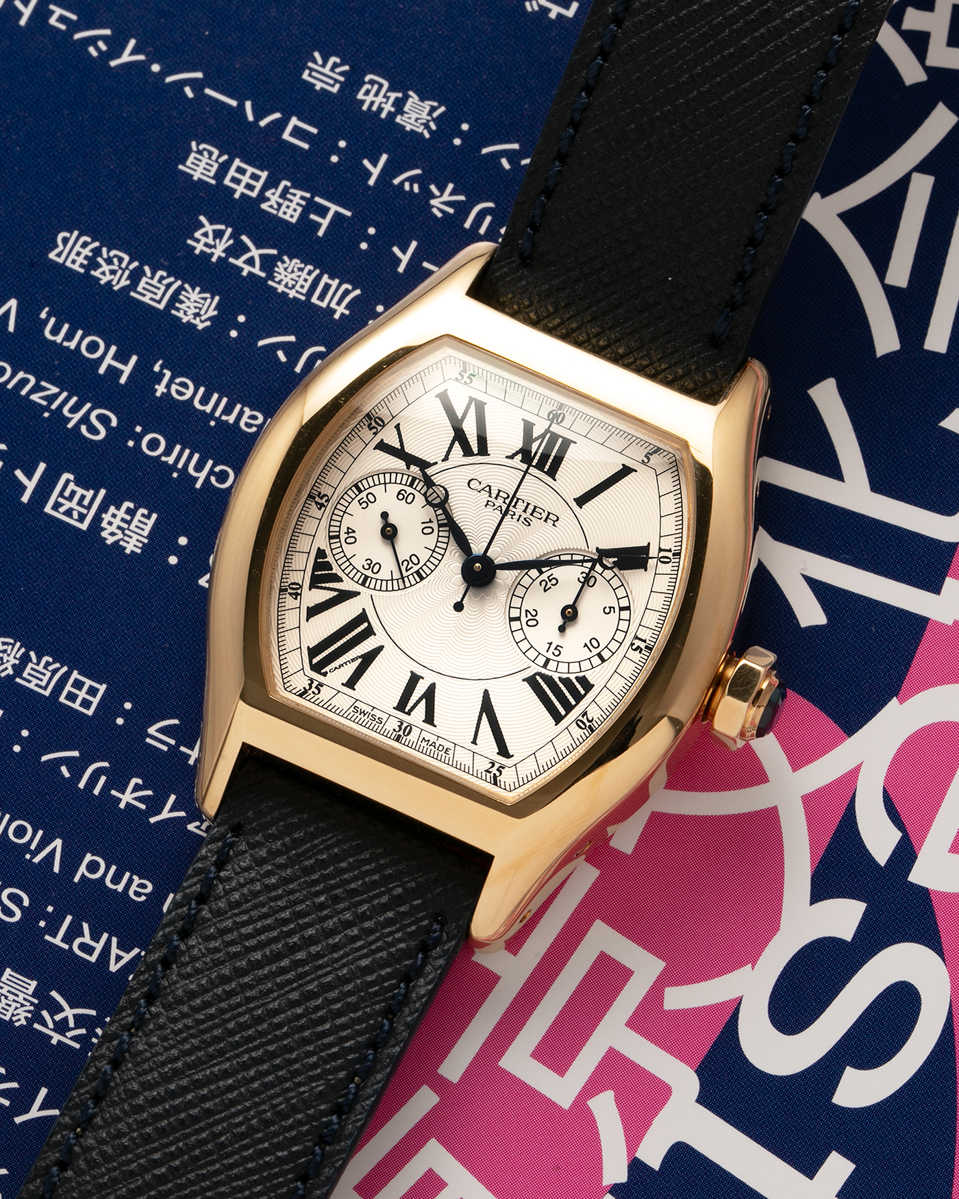 Brand: Cartier Year: 2000’s Model: Collection Privée Cartier Paris Tortue Monopoussoir Reference: 2356E Material: 18-carat Yellow Gold Movement: Cartier THA Cal. 045MC, Manual-Winding Case Diameter: 43mm x 35 mm Lug Width: 18mm Strap: Molequin Navy Blue Textured Calf Leather with Signed 18-carat Yellow Gold Deployant Clasp