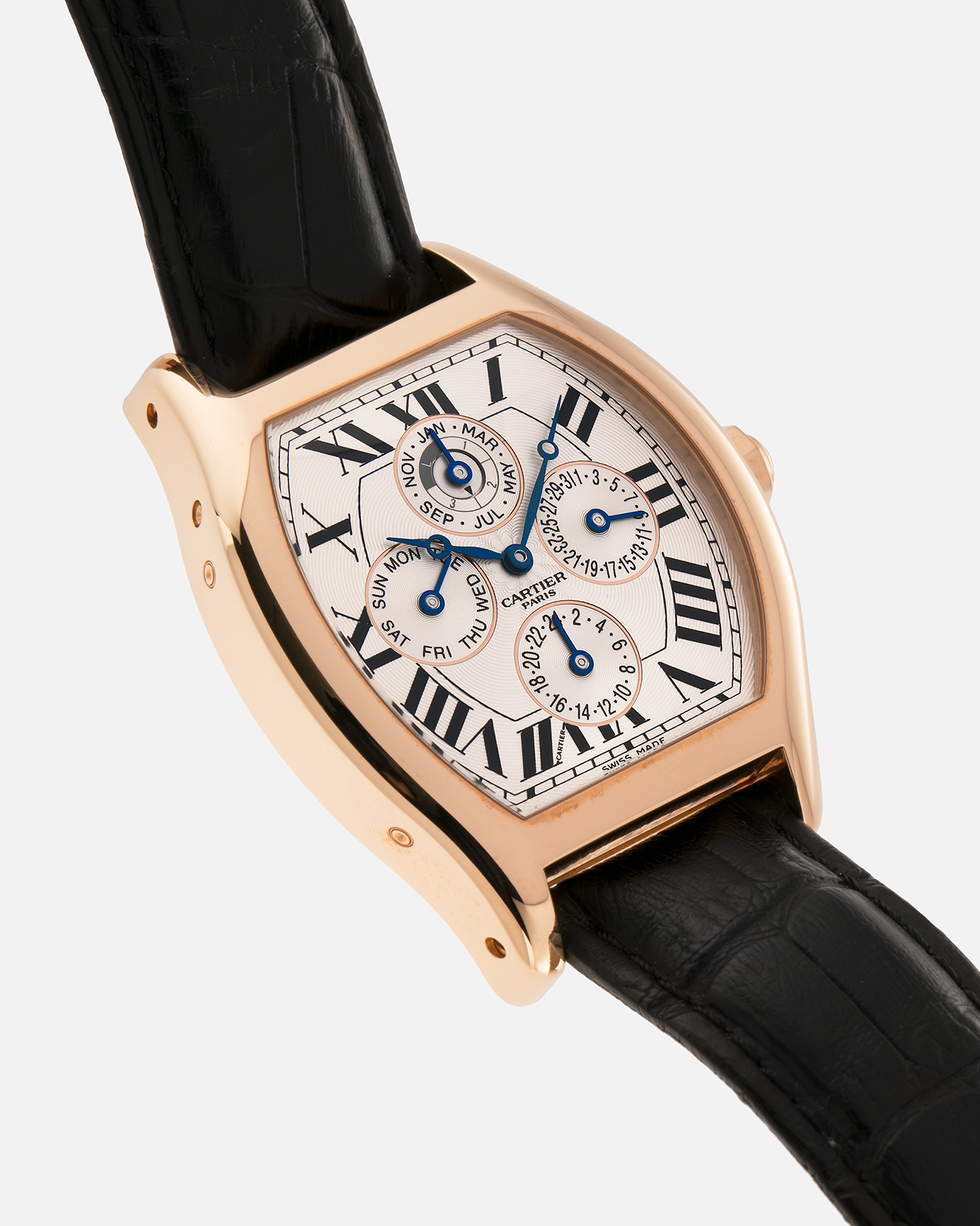 Brand: Cartier
Year: 2005
Model: CPCP Collection Prive Tortue Perpetual Calendar XL
Reference: 2666 / W1542851
Material: 18k Rose Gold
Movement: Cal. 9421MC
Case Diameter: 42.5mm x 34mm (12mm Thickness)
Strap: Cartier Black Alligator with 18k Rose Gold Cartier Deployant