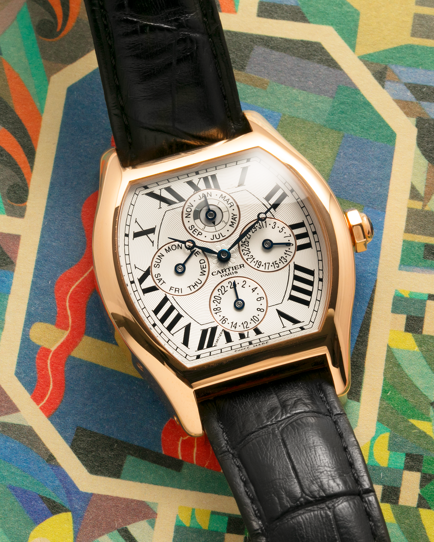 Brand: Cartier
Year: 2005
Model: CPCP Collection Prive Tortue Perpetual Calendar XL
Reference: 2666 / W1542851
Material: 18k Rose Gold
Movement: Cal. 9421MC
Case Diameter: 42.5mm x 34mm (12mm Thickness)
Strap: Cartier Black Alligator with 18k Rose Gold Cartier Deployant