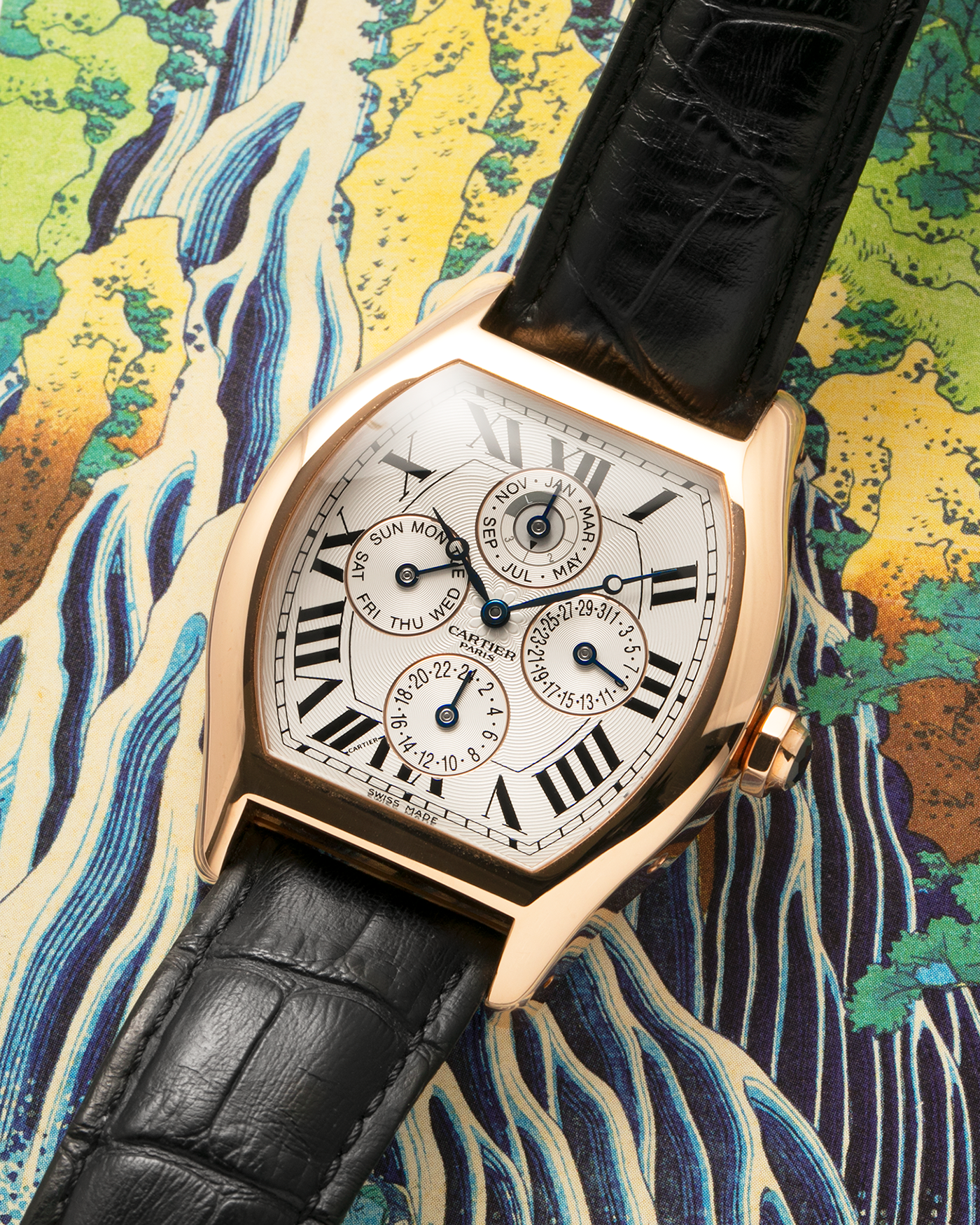 Brand: Cartier
Year: 2005
Model: CPCP Collection Prive Tortue Perpetual Calendar XL
Reference: 2666 / W1542851
Material: 18k Rose Gold
Movement: Cal. 9421MC
Case Diameter: 42.5mm x 34mm (12mm Thickness)
Strap: Cartier Black Alligator with 18k Rose Gold Cartier Deployant