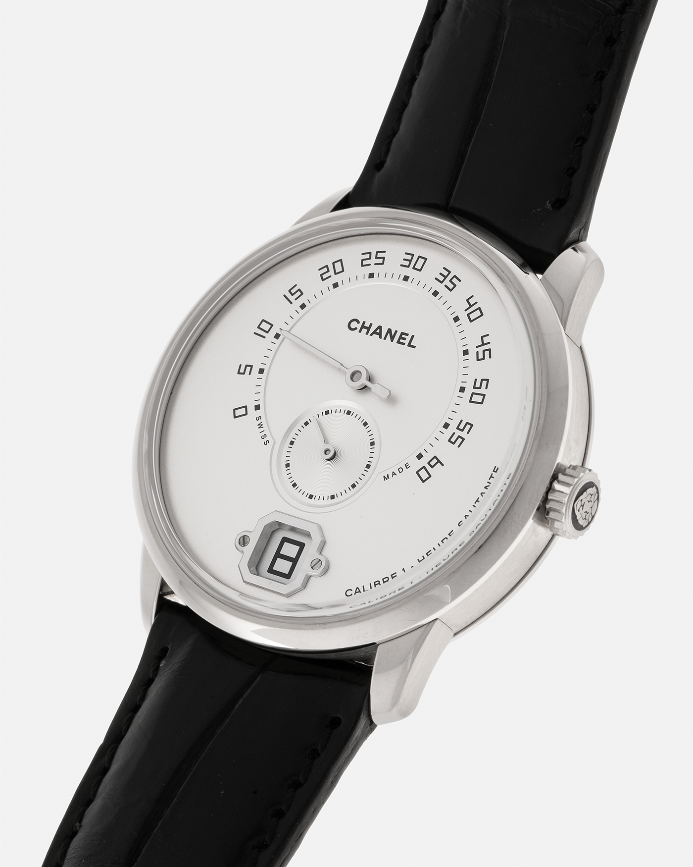 Brand: Chanel
Year: 2017
Model: Monsieur De Chanel Jump Hour H4799
Material: 18-carat White Gold
Movement: Chanel Calibre 1 (Developed with Romain Gauthier), Manual-Winding 
Case Dimensions: 40mm x 10.4mm
Lug Width: 22mm
Strap: Chanel Black Alligator Leather Strap with Signed 18-carat White Gold Tang Buckle