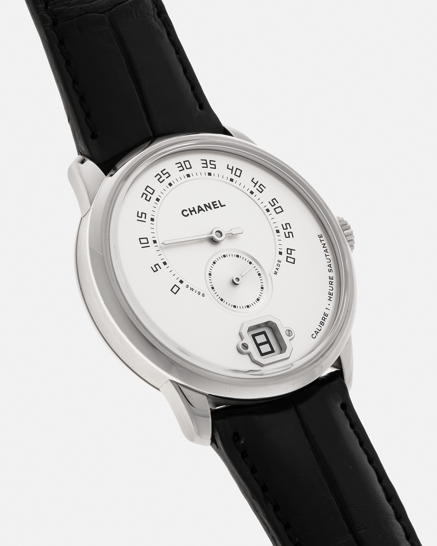 Brand: Chanel
Year: 2017
Model: Monsieur De Chanel Jump Hour H4799
Material: 18-carat White Gold
Movement: Chanel Calibre 1 (Developed with Romain Gauthier), Manual-Winding 
Case Dimensions: 40mm x 10.4mm
Lug Width: 22mm
Strap: Chanel Black Alligator Leather Strap with Signed 18-carat White Gold Tang Buckle