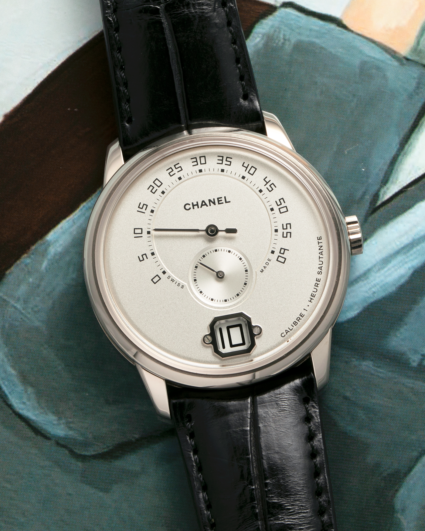Brand: Chanel
Year: 2017
Model: Monsieur De Chanel Jump Hour H4799
Material: 18-carat White Gold
Movement: Chanel Calibre 1 (Developed with Romain Gauthier), Manual-Winding 
Case Dimensions: 40mm x 10.4mm
Lug Width: 22mm
Strap: Chanel Black Alligator Leather Strap with Signed 18-carat White Gold Tang Buckle