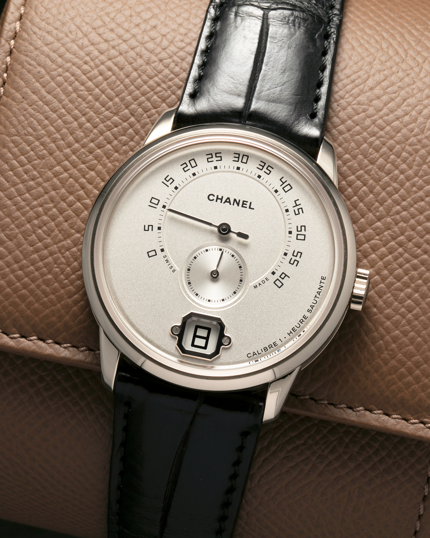 Brand: Chanel
Year: 2017
Model: Monsieur De Chanel Jump Hour H4799
Material: 18-carat White Gold
Movement: Chanel Calibre 1 (Developed with Romain Gauthier), Manual-Winding 
Case Dimensions: 40mm x 10.4mm
Lug Width: 22mm
Strap: Chanel Black Alligator Leather Strap with Signed 18-carat White Gold Tang Buckle