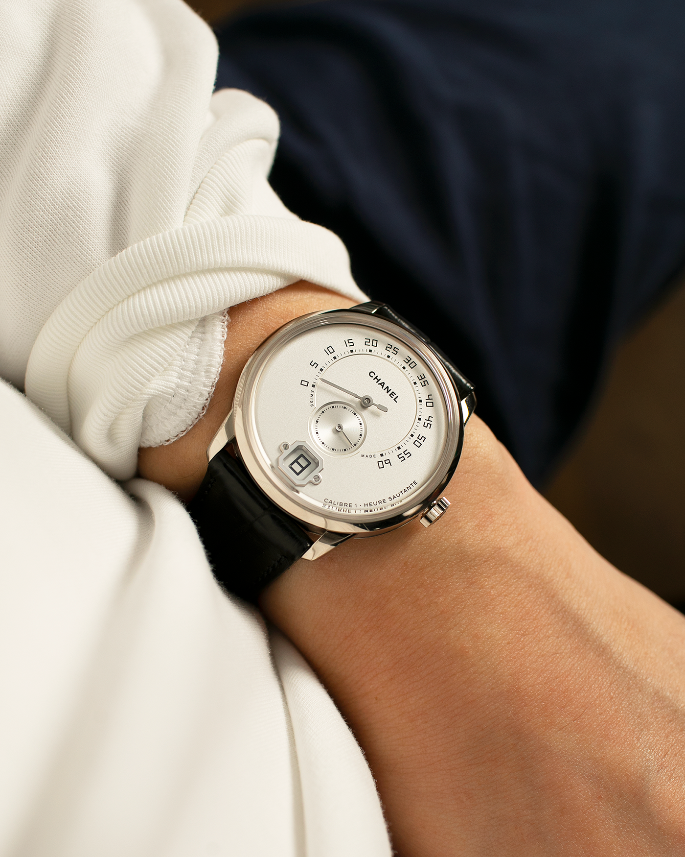 Brand: Chanel
Year: 2017
Model: Monsieur De Chanel Jump Hour H4799
Material: 18-carat White Gold
Movement: Chanel Calibre 1 (Developed with Romain Gauthier), Manual-Winding 
Case Dimensions: 40mm x 10.4mm
Lug Width: 22mm
Strap: Chanel Black Alligator Leather Strap with Signed 18-carat White Gold Tang Buckle