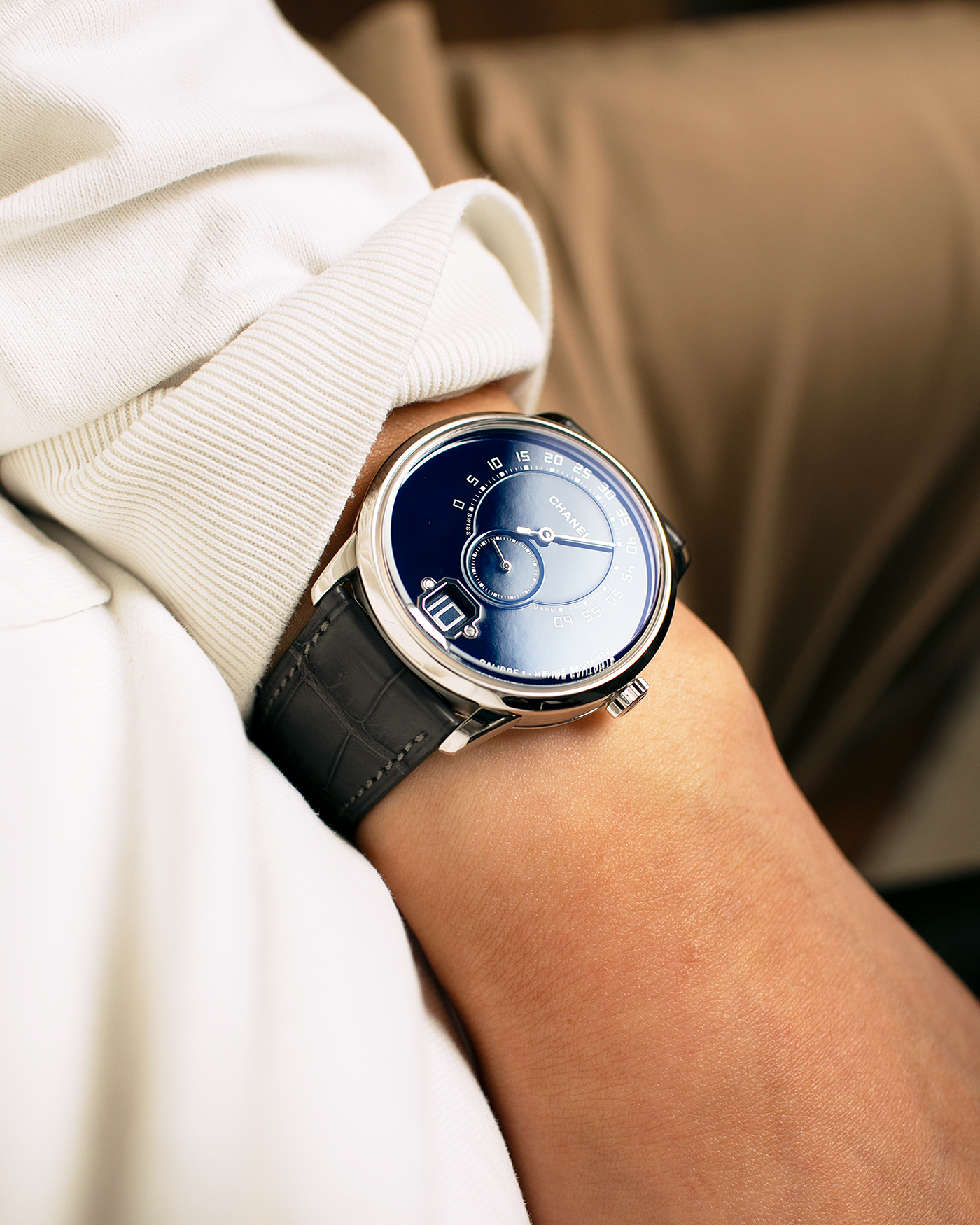 Brand: Chanel
Year: 2018
Model: Monsieur De Chanel Jump Hour, Limited to 20 Pieces
Reference: H5467
Material: Platinum 950 Case and Deployant Clasp, Blue Enamel Dial
Movement: Chanel Calibre 1 (Developed with Romain Gauthier), Manual-Winding 
Case Dimensions: 40mm x 10.4mm
Lug Width: 22mm
Straps: Chanel Grey Alligator Leather Strap with Signed Platinum 950 Deployant Clasp, with extra Chanel Black Alligator Leather Strap (Used)