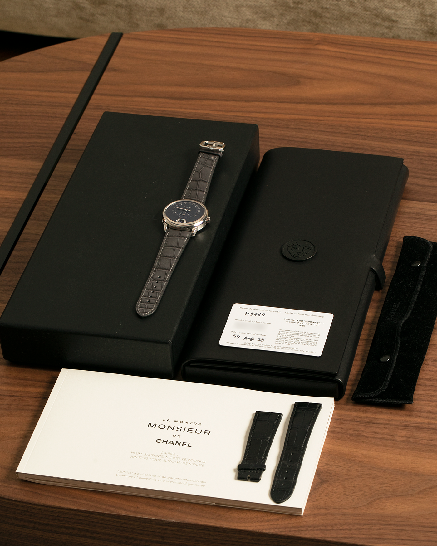 Brand: Chanel
Year: 2018
Model: Monsieur De Chanel Jump Hour, Limited to 20 Pieces
Reference: H5467
Material: Platinum 950 Case and Deployant Clasp, Blue Enamel Dial
Movement: Chanel Calibre 1 (Developed with Romain Gauthier), Manual-Winding 
Case Dimensions: 40mm x 10.4mm
Lug Width: 22mm
Straps: Chanel Grey Alligator Leather Strap with Signed Platinum 950 Deployant Clasp, with extra Chanel Black Alligator Leather Strap (Used)