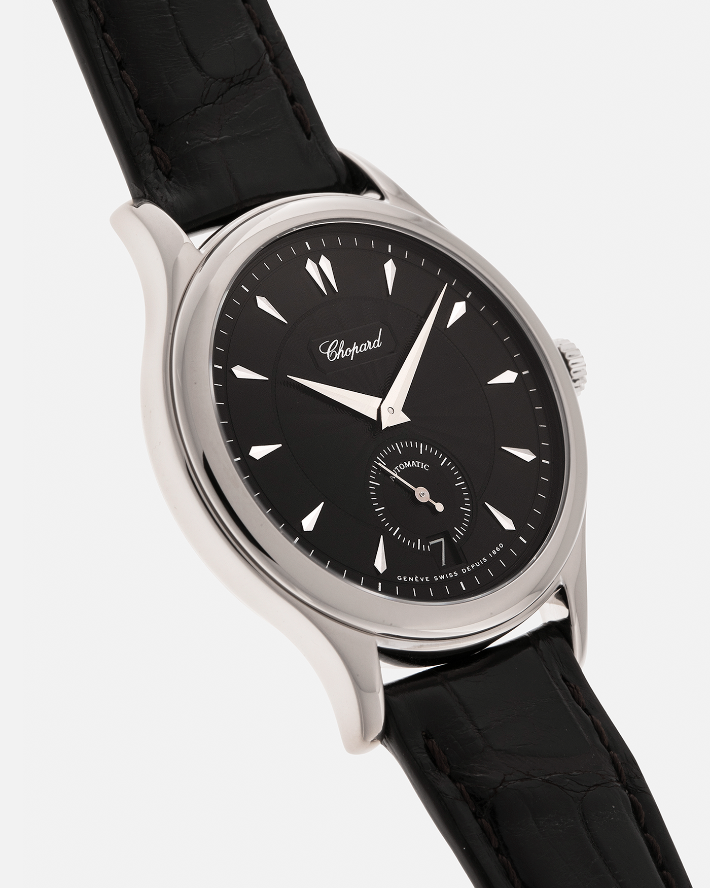 Brand: Chopard L.U.C.
Year: 1998
Model: 16/1860/2
Material: 18-carat White Gold
Movement: Chopard Cal. 1.96, Self-Winding Micro-Rotor
Case Dimensions: 37mm x 8.5mm (Lug-to-Lug 45mm)
Lug Width: 18mm
Strap: Chopard Black Alligator Leather Strap with Signed 18-carat White Gold Tang Buckle