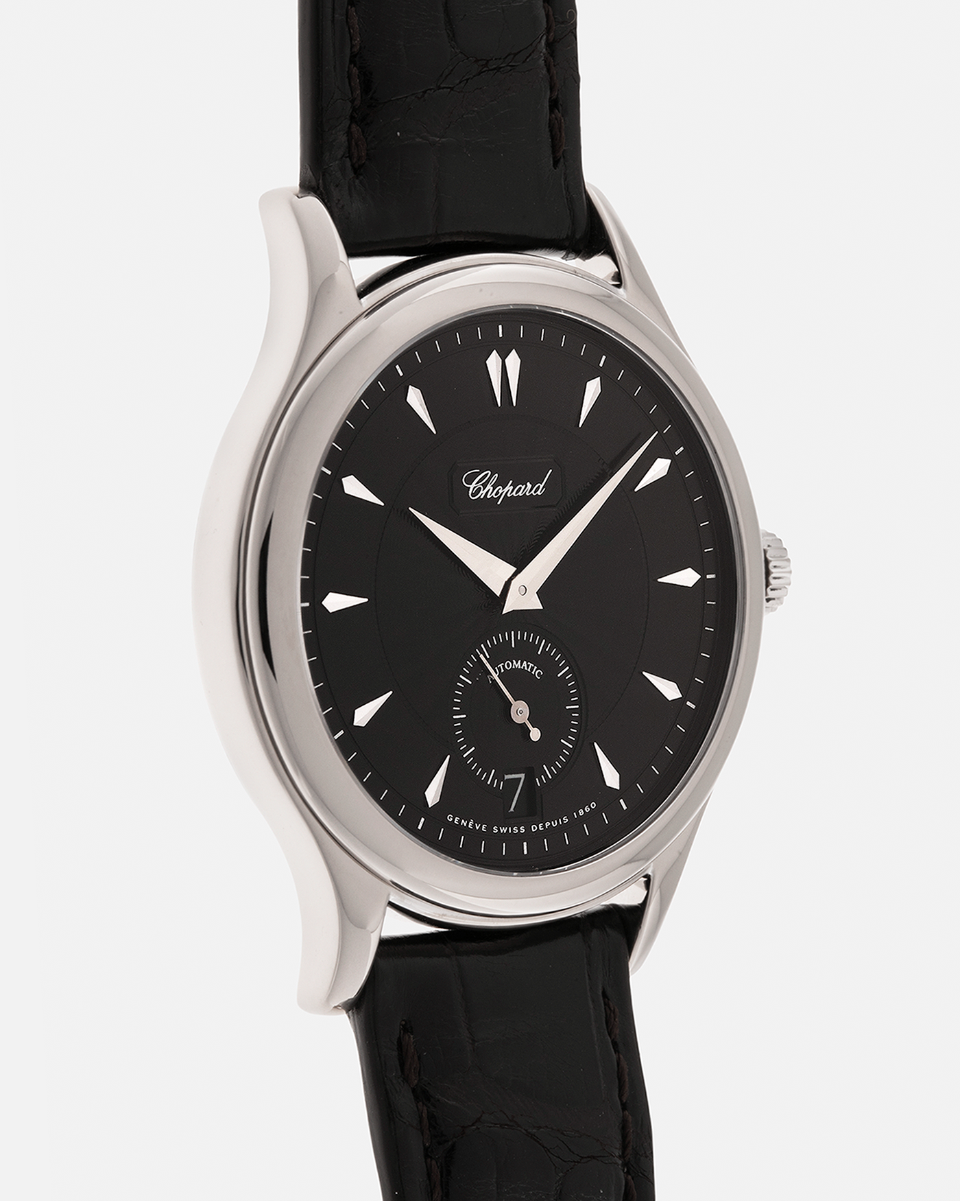 Brand: Chopard L.U.C.
Year: 1998
Model: 16/1860/2
Material: 18-carat White Gold
Movement: Chopard Cal. 1.96, Self-Winding Micro-Rotor
Case Dimensions: 37mm x 8.5mm (Lug-to-Lug 45mm)
Lug Width: 18mm
Strap: Chopard Black Alligator Leather Strap with Signed 18-carat White Gold Tang Buckle