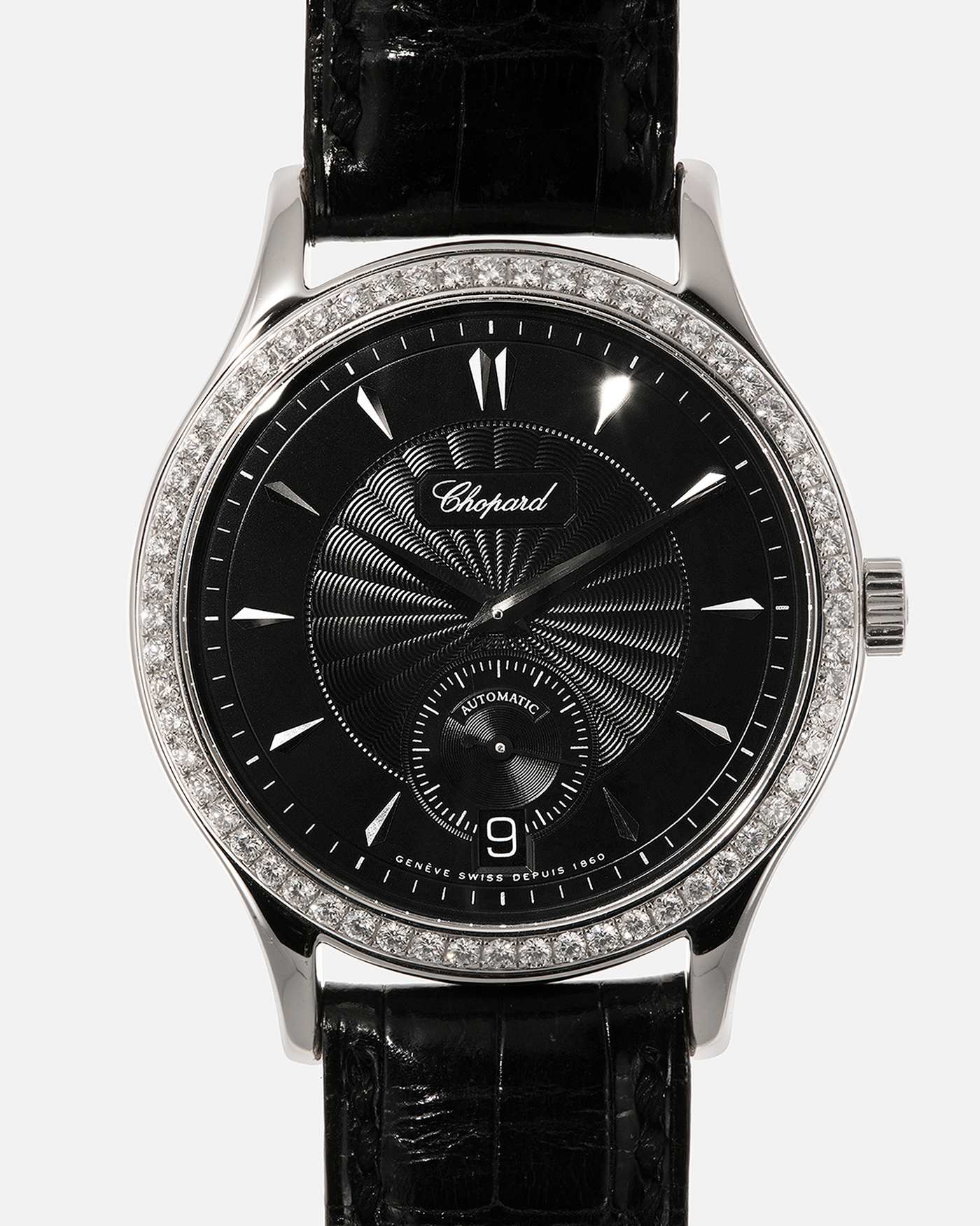 Brand: Chopard L.U.C.
Year: Late 1990s
Model: 17/1860/2
Material: 18-carat White Gold Case, Factory-Set Diamond Bezel
Movement: Chopard Cal. 1.96, Self-Winding Micro-Rotor
Case Dimensions: 37mm x 8.5mm (Lug-to-Lug 45mm)
Lug Width: 18mm
Strap: Chopard Black Alligator Leather Strap with Signed 18-carat White Gold Tang Buckle