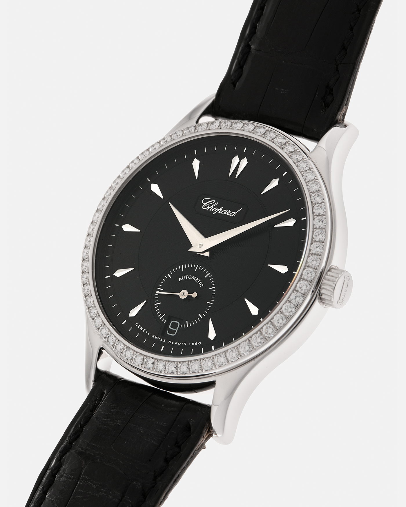 Brand: Chopard L.U.C.
Year: Late 1990s
Model: 17/1860/2
Material: 18-carat White Gold Case, Factory-Set Diamond Bezel
Movement: Chopard Cal. 1.96, Self-Winding Micro-Rotor
Case Dimensions: 37mm x 8.5mm (Lug-to-Lug 45mm)
Lug Width: 18mm
Strap: Chopard Black Alligator Leather Strap with Signed 18-carat White Gold Tang Buckle