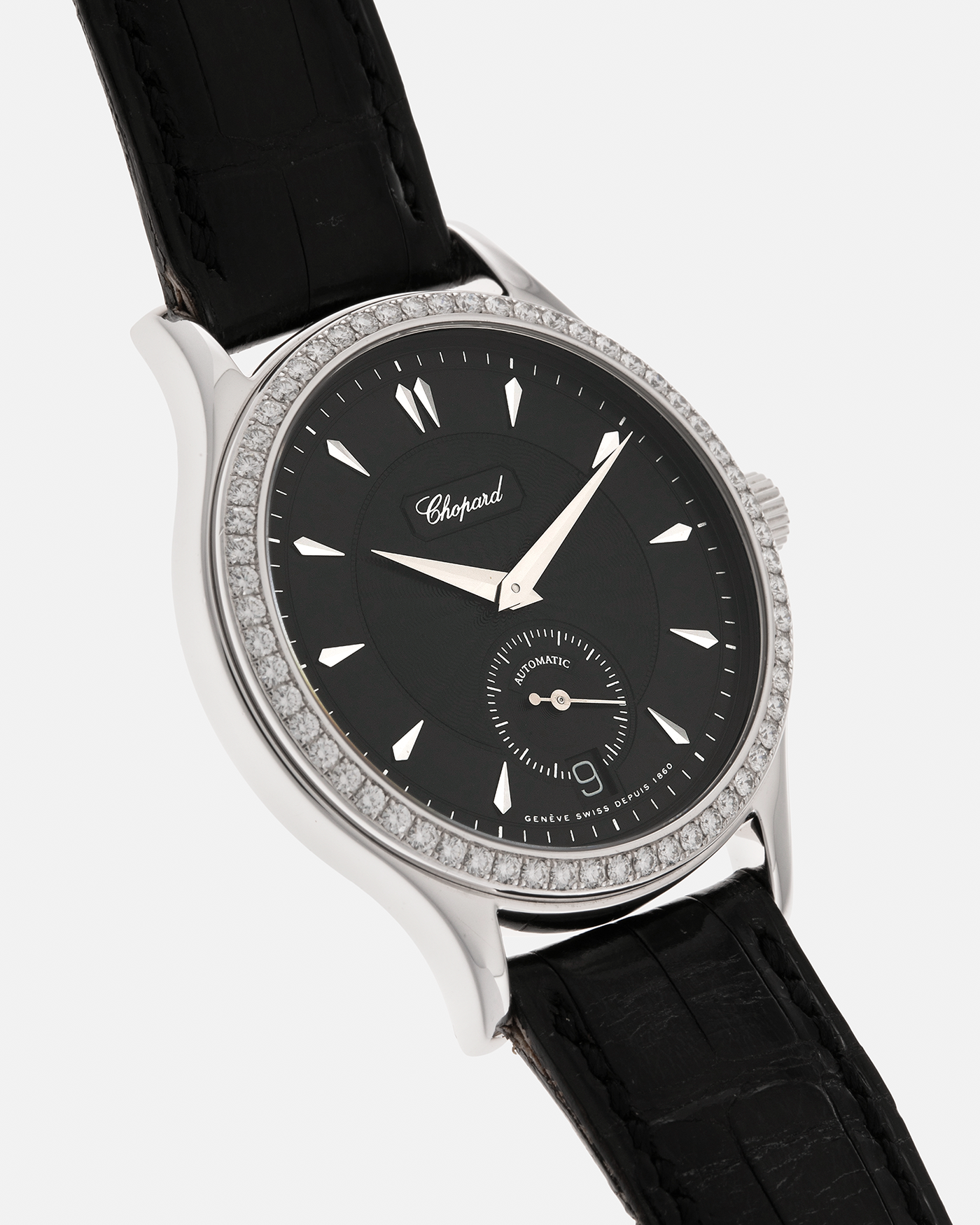 Brand: Chopard L.U.C.
Year: Late 1990s
Model: 17/1860/2
Material: 18-carat White Gold Case, Factory-Set Diamond Bezel
Movement: Chopard Cal. 1.96, Self-Winding Micro-Rotor
Case Dimensions: 37mm x 8.5mm (Lug-to-Lug 45mm)
Lug Width: 18mm
Strap: Chopard Black Alligator Leather Strap with Signed 18-carat White Gold Tang Buckle