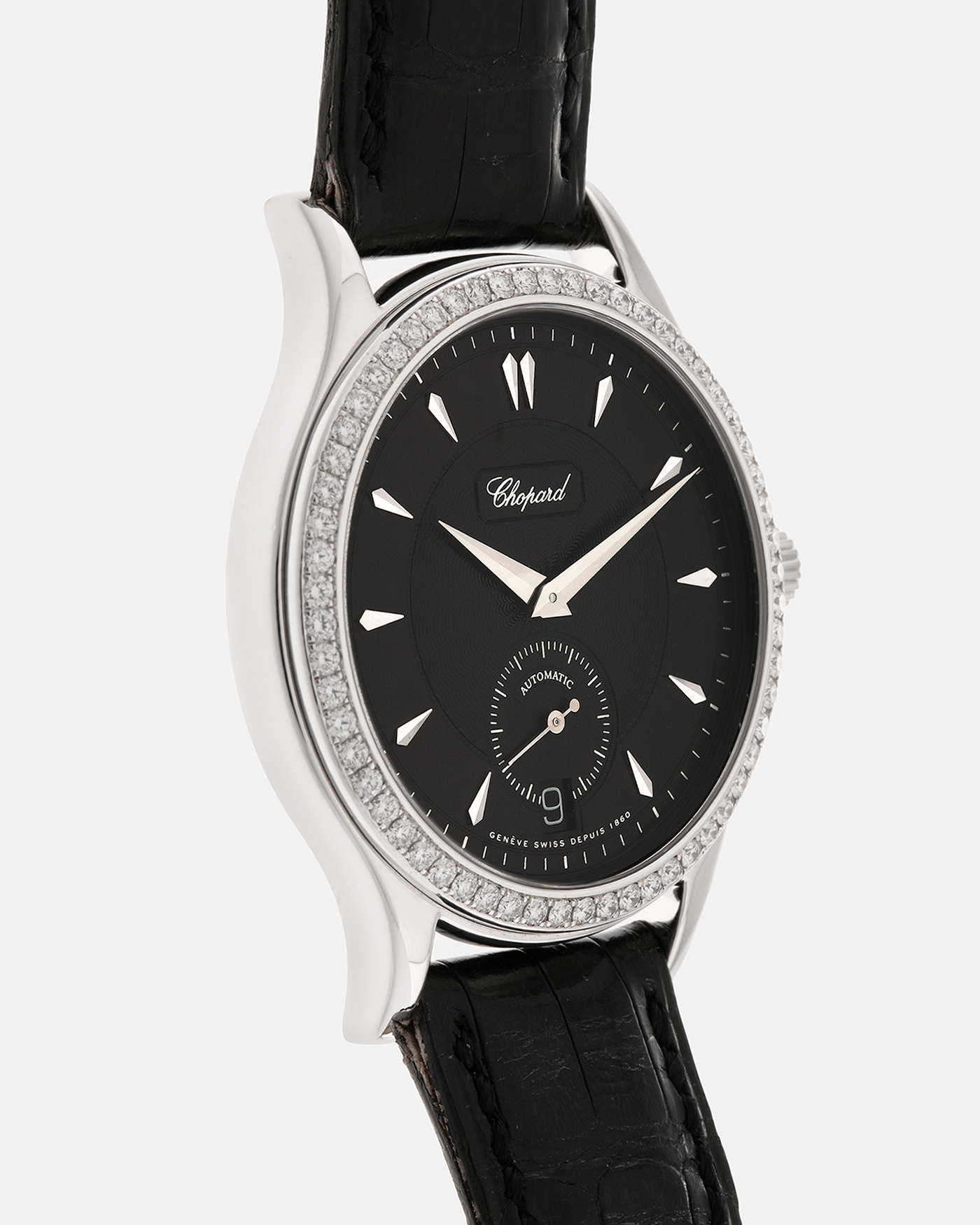 Brand: Chopard L.U.C.
Year: Late 1990s
Model: 17/1860/2
Material: 18-carat White Gold Case, Factory-Set Diamond Bezel
Movement: Chopard Cal. 1.96, Self-Winding Micro-Rotor
Case Dimensions: 37mm x 8.5mm (Lug-to-Lug 45mm)
Lug Width: 18mm
Strap: Chopard Black Alligator Leather Strap with Signed 18-carat White Gold Tang Buckle