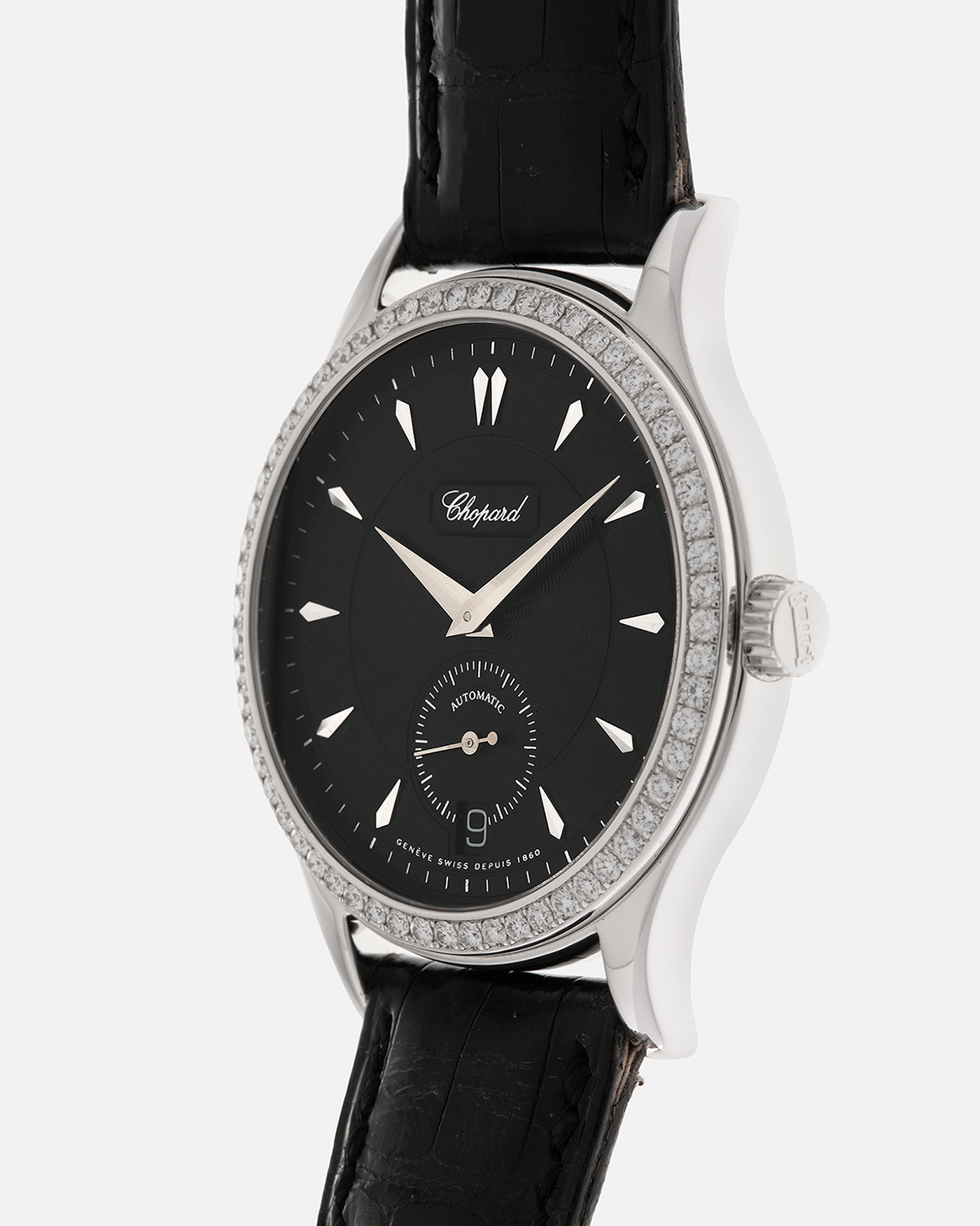 Brand: Chopard L.U.C.
Year: Late 1990s
Model: 17/1860/2
Material: 18-carat White Gold Case, Factory-Set Diamond Bezel
Movement: Chopard Cal. 1.96, Self-Winding Micro-Rotor
Case Dimensions: 37mm x 8.5mm (Lug-to-Lug 45mm)
Lug Width: 18mm
Strap: Chopard Black Alligator Leather Strap with Signed 18-carat White Gold Tang Buckle